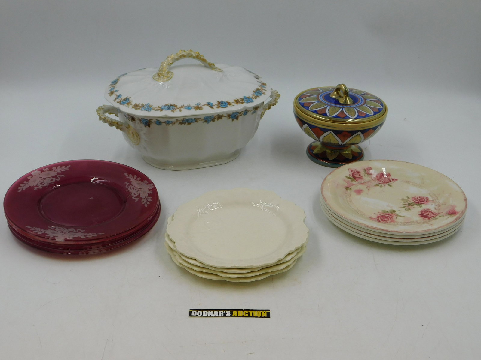 Lot of Dishes: Lot of Dishes including Iridescent Compote signed Italy, Limoges Soup Tureen, 4 Cut to Clear Plates, 4 Wedgewood Plates and More. This sale will be broadcast live on sale day with full descriptions of
