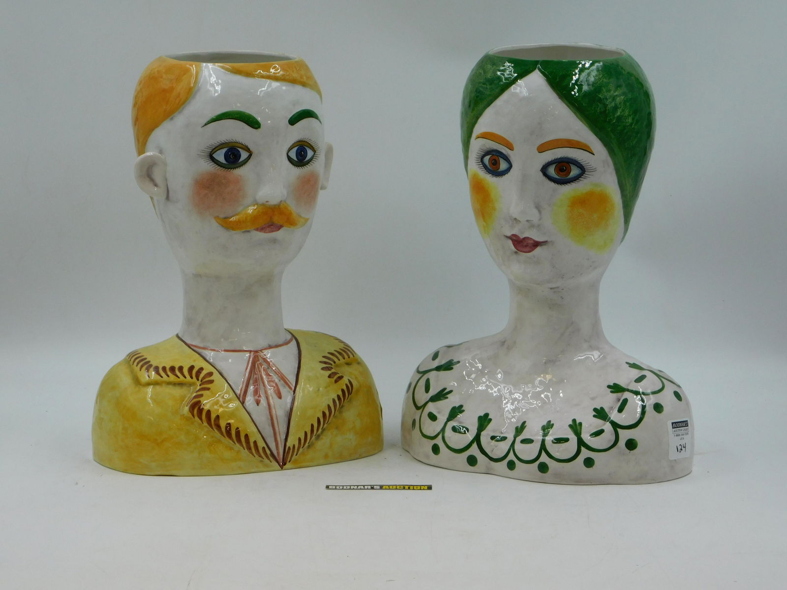 Pair of Modern Bust Plant Holders: Pair of Modern Bust Plant Holders. Signed Horchow - Italy. Measures 15.5" tall x 11" wide. This sale will be broadcast live on sale day with full descriptions of each lot being sold. All items MUST be