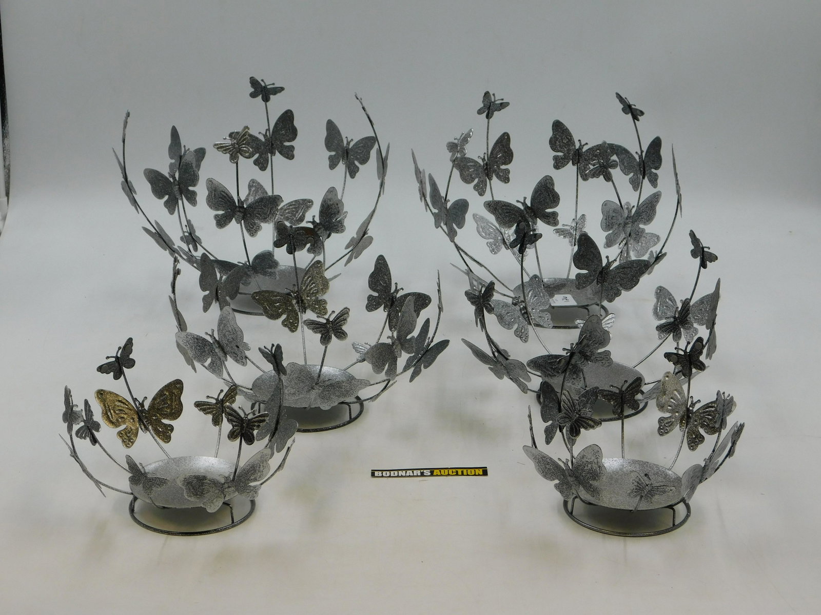 Lot of 6 Butterfly Decor Plant/Candle Holders: Lot of 6 Butterfly Decor Plant/Candle Holders. Measures 5.5" - 9" tall x 7.5" - 11" wide. This sale will be broadcast live on sale day with full descriptions of each lot being sold. All items MUST be 