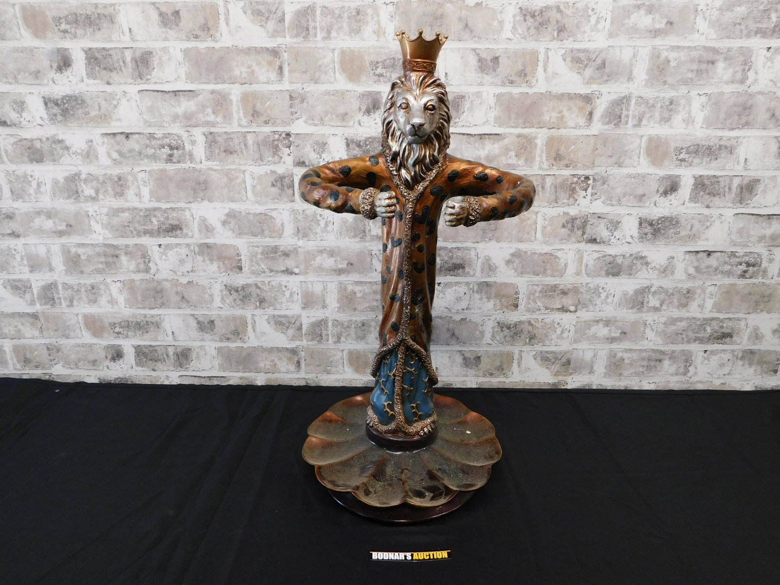 Mythological Lion King Umbrella Stand: Resin Mythological Lion King Umbrella Stand. Measures 25" tall x 12" wide. Has some chips and cracks on arms. Possibly repaired. This sale will be broadcast live on sale day with full descriptions of 
