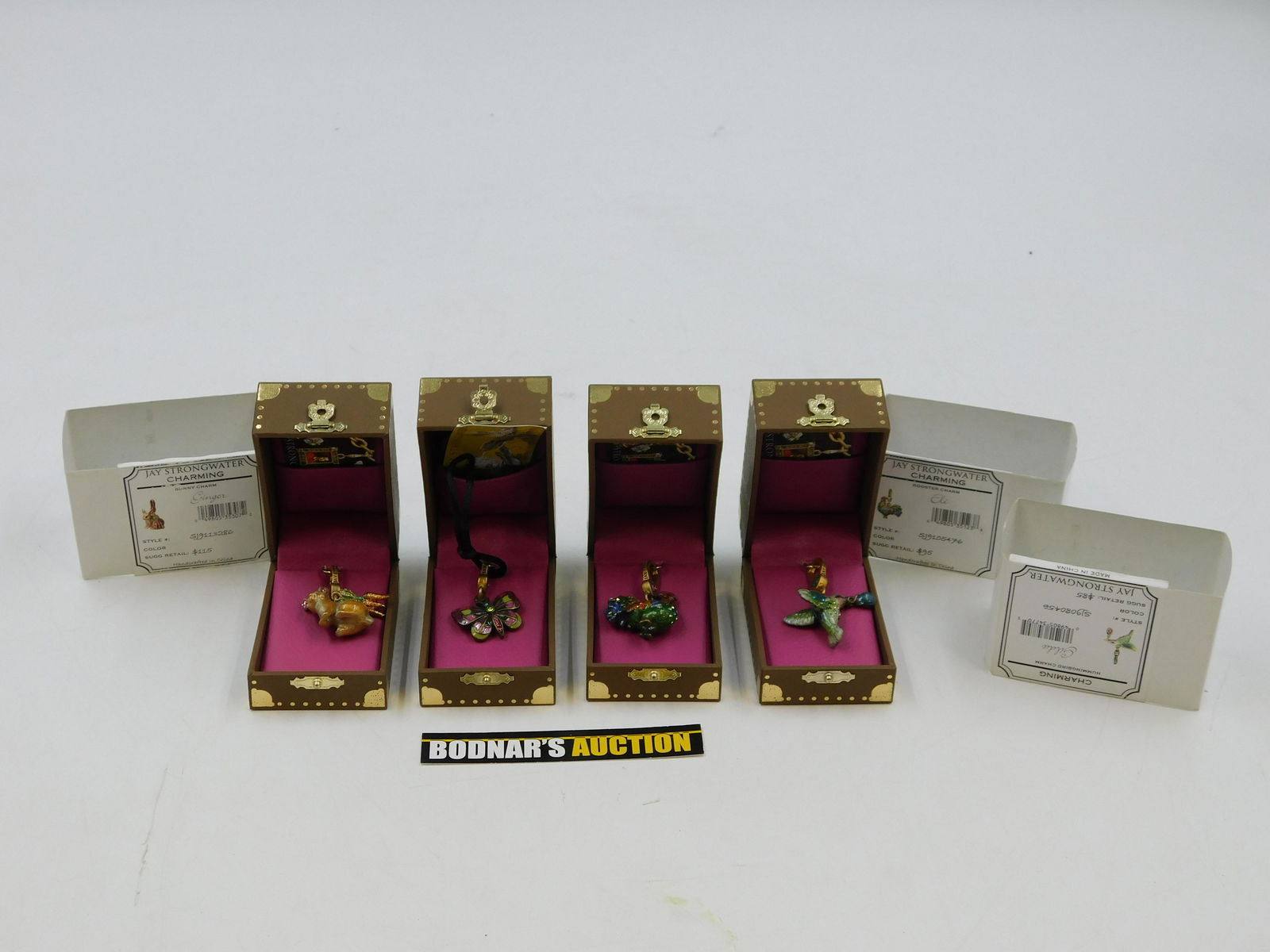 Lot of 4 Jay Strongwater Charms: Lot of 4 Jay Strongwater Charms including Rooster - Eli, Hummingbird - Gilda, Bunny - Ginger, and Butterfly. All come with Original Box. There are no reserves in the entire sale. All invoices must be