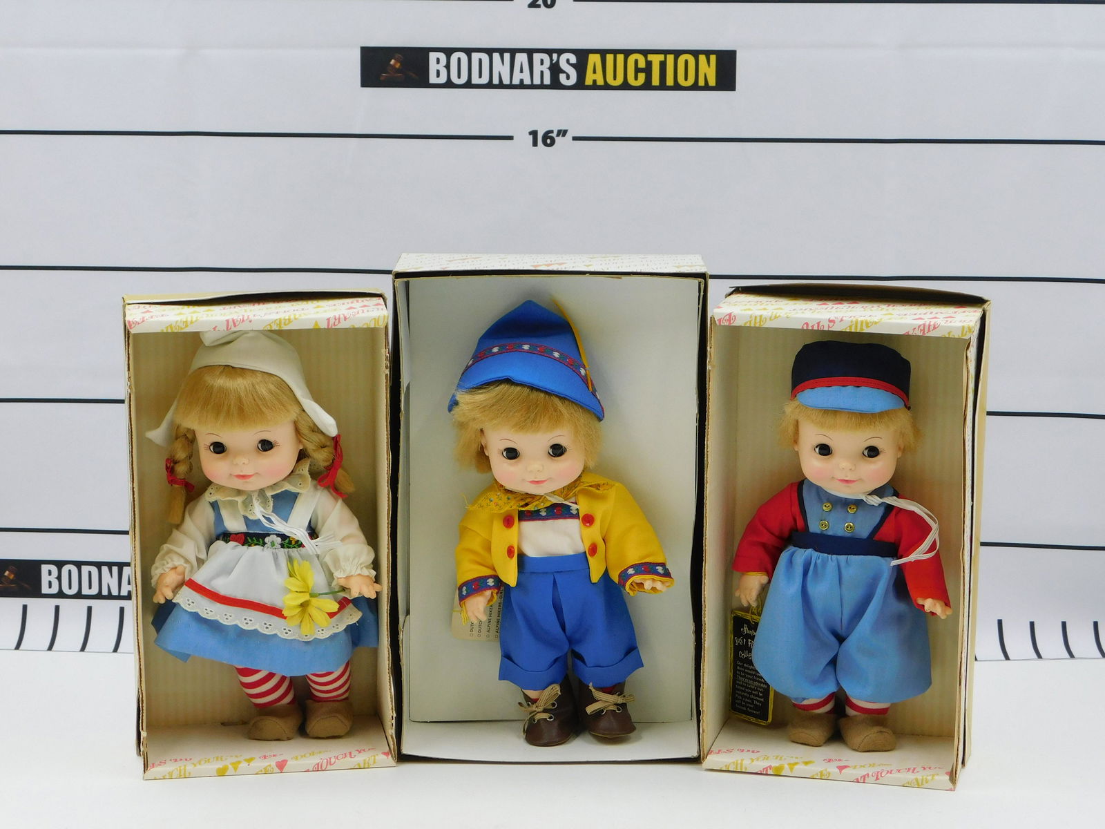 Lot of 3 Effanbee Dolls: Lot of 3 Just Friends Effanbee Dolls including Dutch Treat - Boy, Dutch Treat - Girl, and Swiss Yodelers - Boy. They measure approx. 11" tall and come in original boxes. This sale will be broadcast li