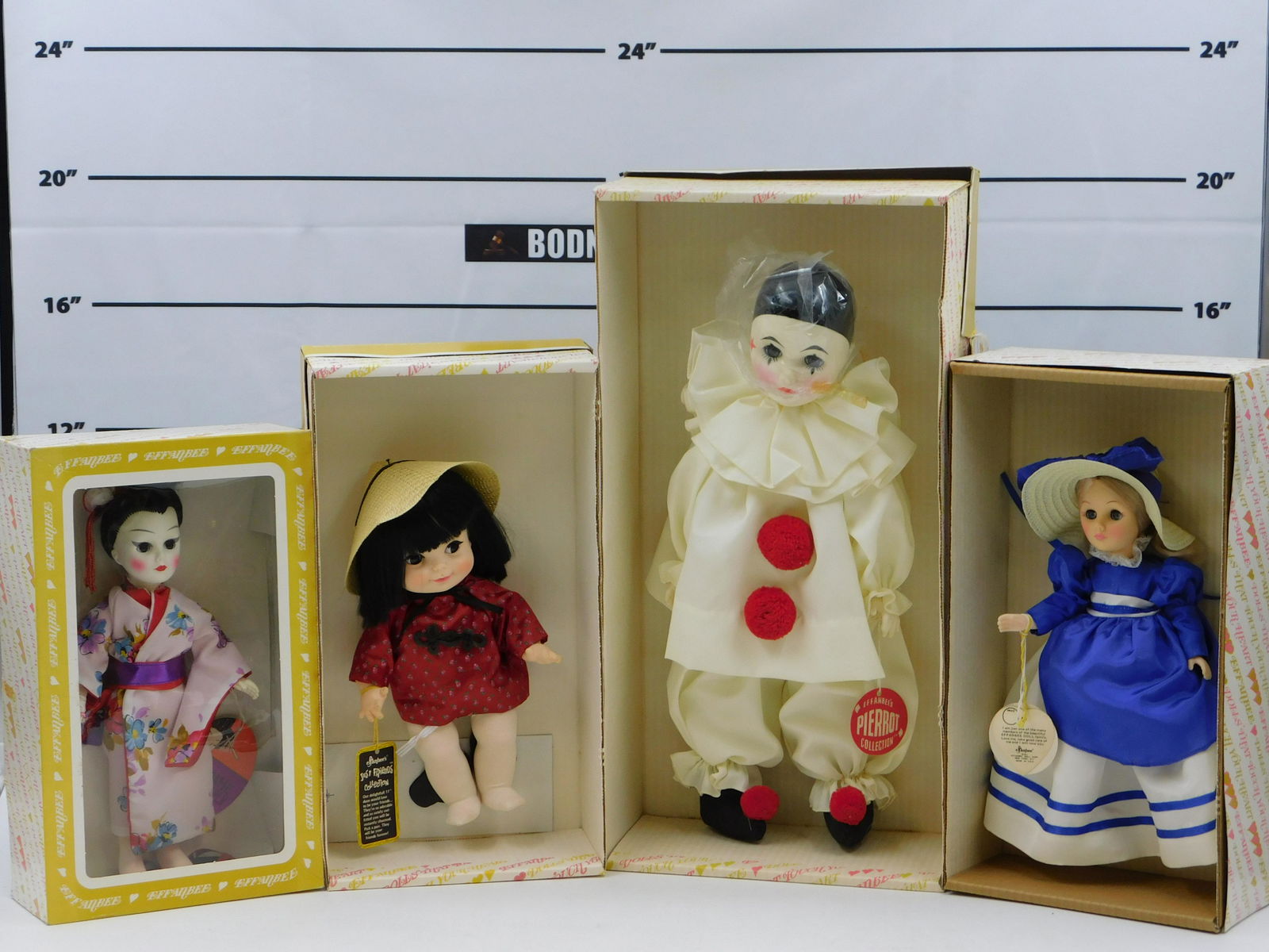 Lot of 4 Effanbee Dolls: Lot of 4 Effanbee Dolls including Fortune Cookie - Girl - 11", Nancy - 11", Madame Butterfly - 11", and Pierrot Collection Doll #4745 A - 17". All come in original boxes. This sale will be broadcast l
