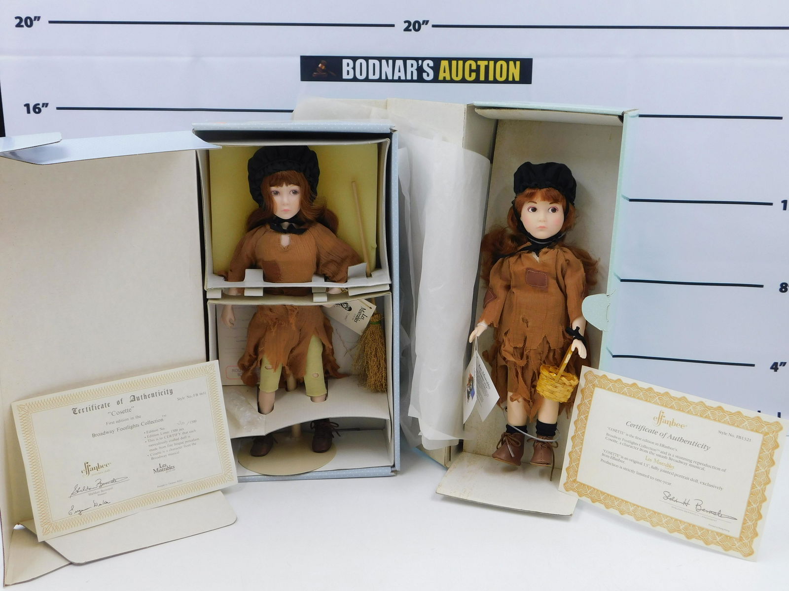 Lot of 2 Effanbee Dolls: Lot of 2 Effanbee Les MisÃ©rables Dolls including Cosette - 13" Vinyl and Cosette - 14" Porcelain. Both come in original boxes with COA's. This sale will be broadcast live on sale day with full desc