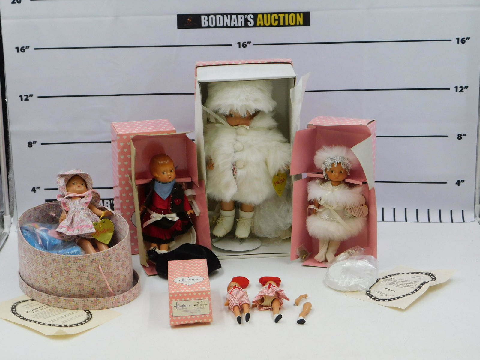 Lot of 5 Effanbee Dolls: Lot of 5 Effanbee Dolls including Christmas Patsy - 13", Patsyette Ice Skater - 8" - Head is a little loose, Patsyette Cowgirl - 8", Patsyette Hat Box Set - 8" - Loose Head with COA, and Wee Patsy Twi