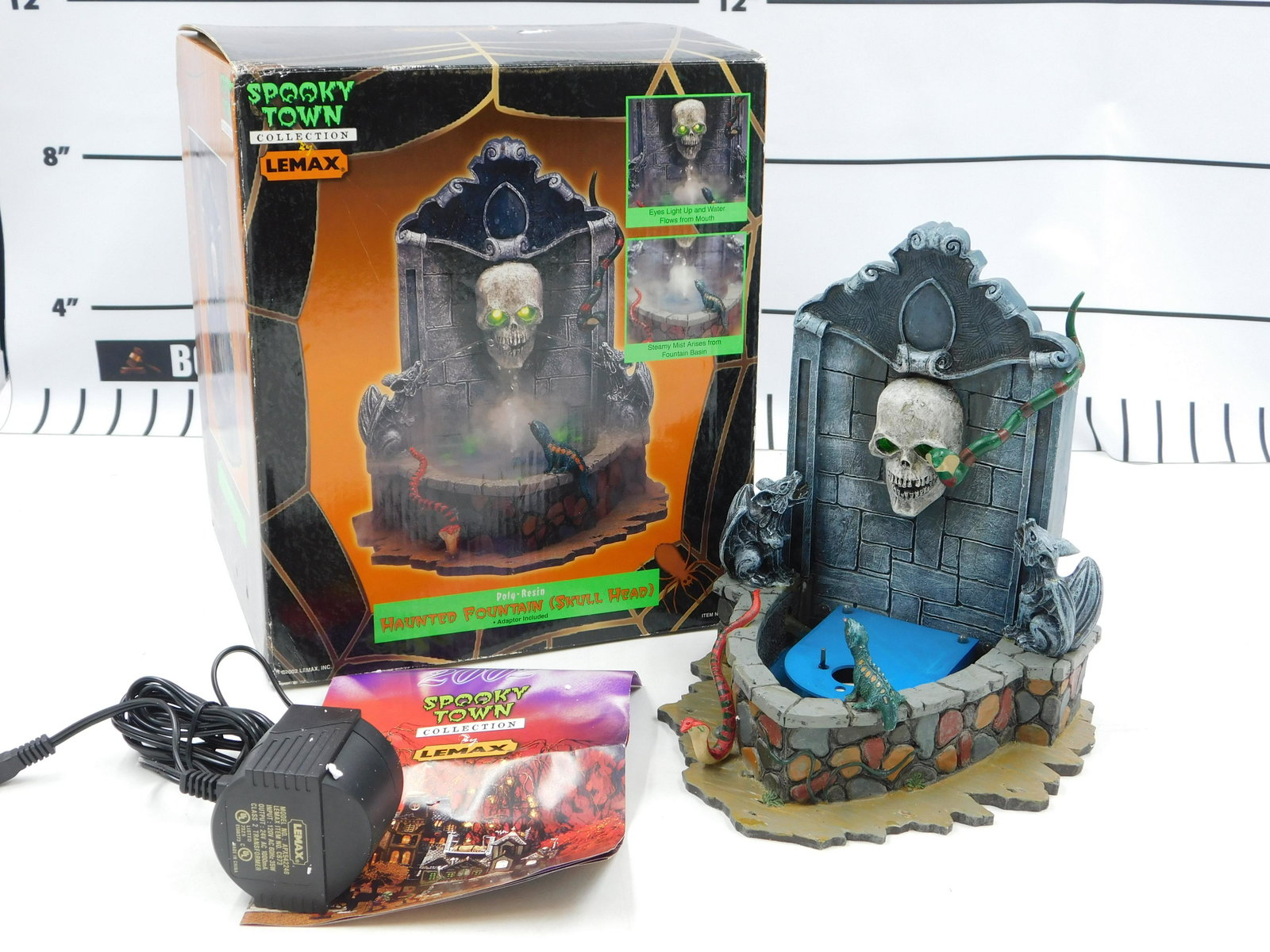 Lemax Spooky Town Haunted Fountain (Skull Head): Lemax Spooky Town Haunted Fountain (Skull Head) - In Original Box. Box has some wear. All invoices must be paid within 24 hours of the sale. All items are shipped USPS or UPS and will be billed separa