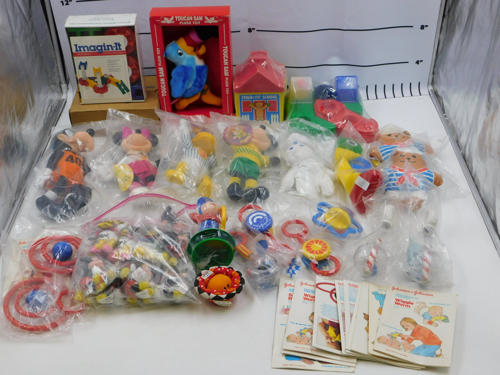 Lot of Children's Toys: Lot of Children's Toys including Disney Plush, Johnson & Johnson Red Rings, Rattles and More. All invoices must be paid within 24 hours of the sale. All items are shipped USPS or UPS and will be bille