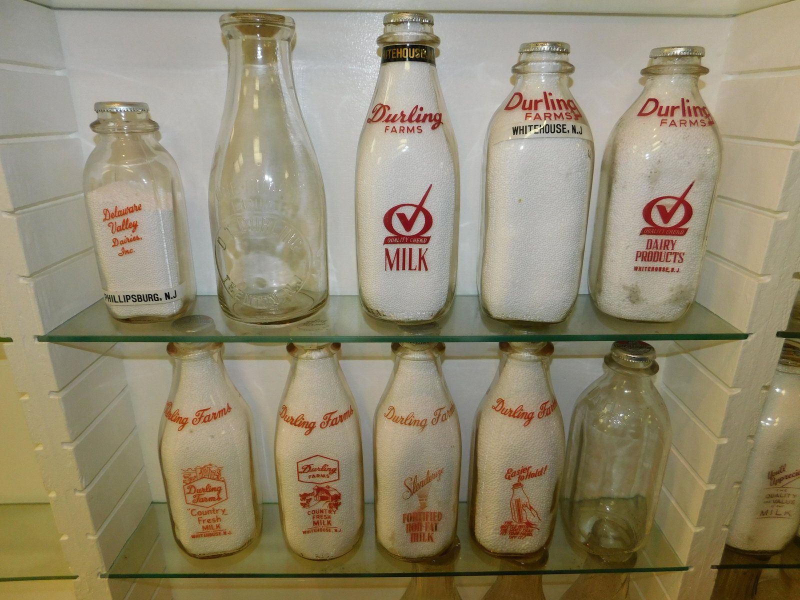 Lot of 10 New Jersey Dairy Bottles: Lot of 10 NJ Dairy Bottles including Delaware Valley Dairies - Phillipsburg, Dt Durling - Trenton, and (8) Durling Farms - Whitehouse. All bottles have tops. Measures between 8"tall - 10.5" tall. Plea