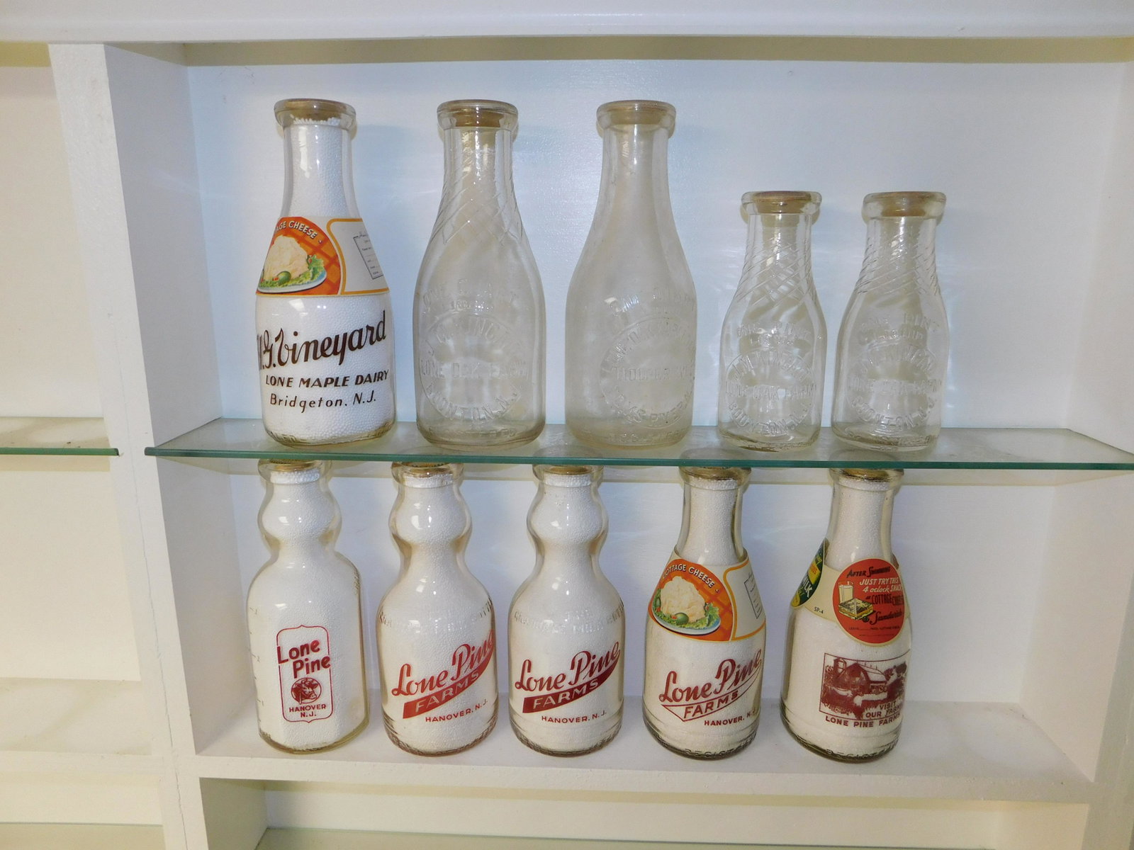 Lot of 10 NJ Dairy Bottles: Lot of 10 NJ Dairy Bottles including Lone Oak Farm Dairy - Toms River, Hg Vineyard Lone Maple Dairy - Bridgeton, (3) Jm Kincaid Lone Oak Farm - Boonton, and (5) Lone Pine Farms - Hanover 2 w/paper sle