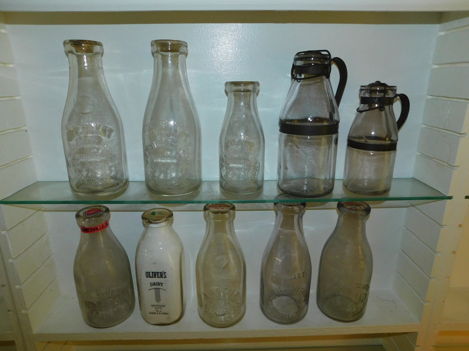 Lot of 10 NJ Dairy Bottles: Lot of 10 NJ Dairy Bottles including (2) Ag Smalley & Co. - Boston, Oliver's Dairy - Neptune City, Old Homestead Farm - Hainesville - crack at top, Oradell Dairy Farms - Oradell, Orange Co. Milk, I Gu