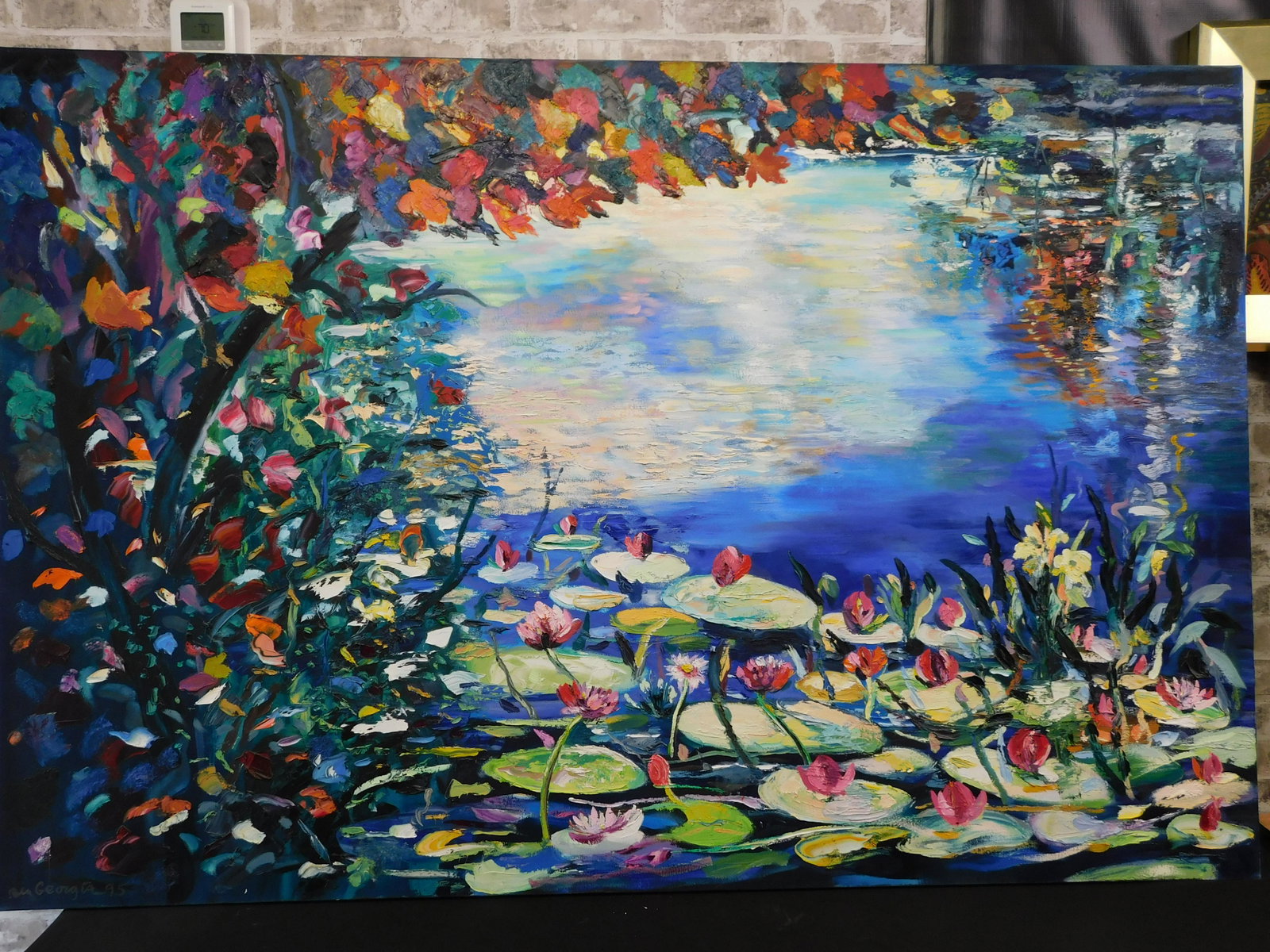 Water Lilies Oil on Canvas: Oversized oil on canvas by Ben Georgia (American New Jersey 1941-) entitled "Water Lilies" depicting a colorful display of water lilies . Signed lower left Ben Georgia 1995 and . Signed on back of can
