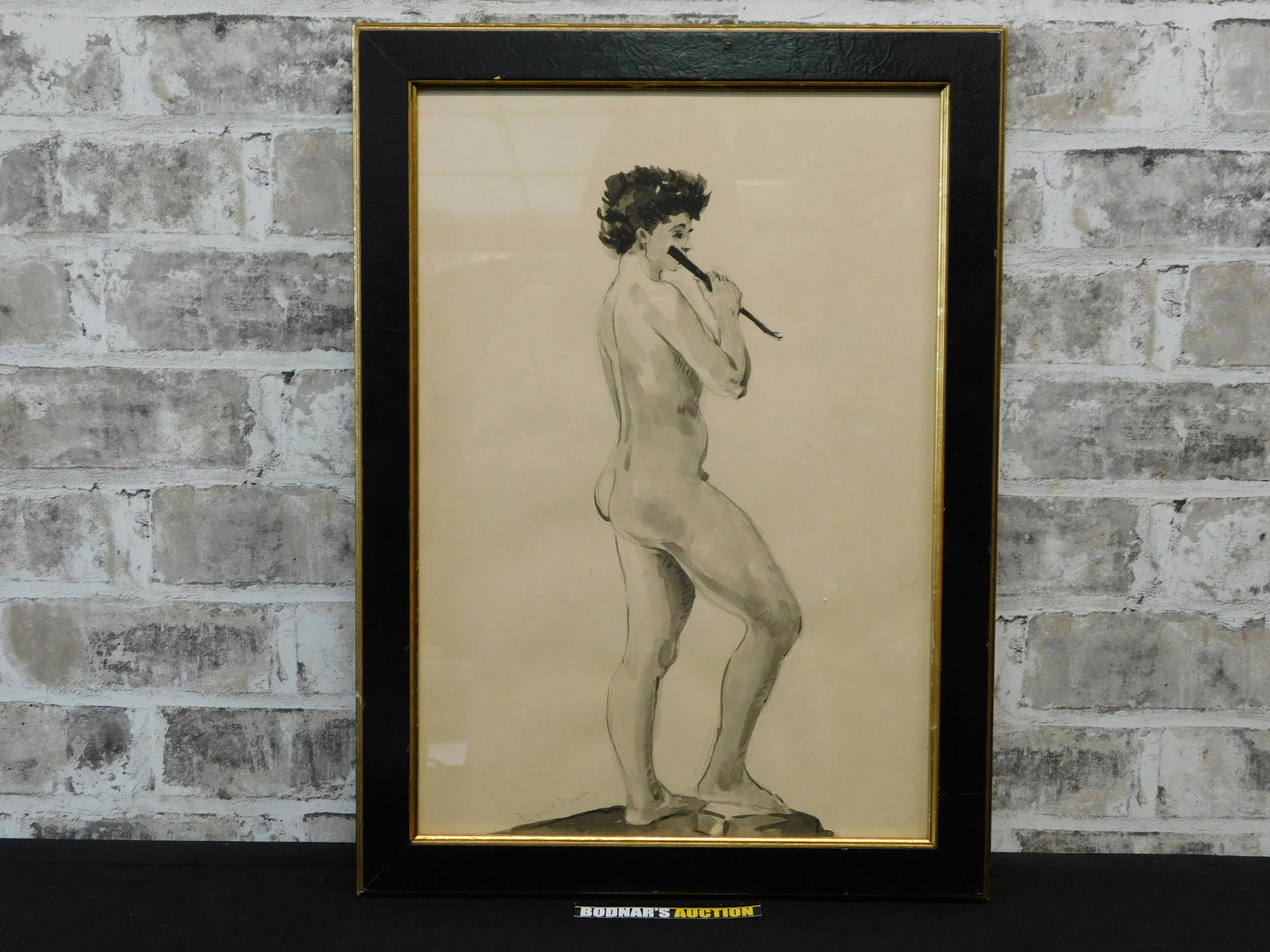 Framed Watercolor and Ink Wash by Reginald Marsh: Framed watercolor and ink wash by Reginald Marsh (American 1898-1954) depicting a nude flute player. . Signed in pencil lower left/center Reginald Marsh. Frame measures approx. 19" tall x 14" wide. Pl