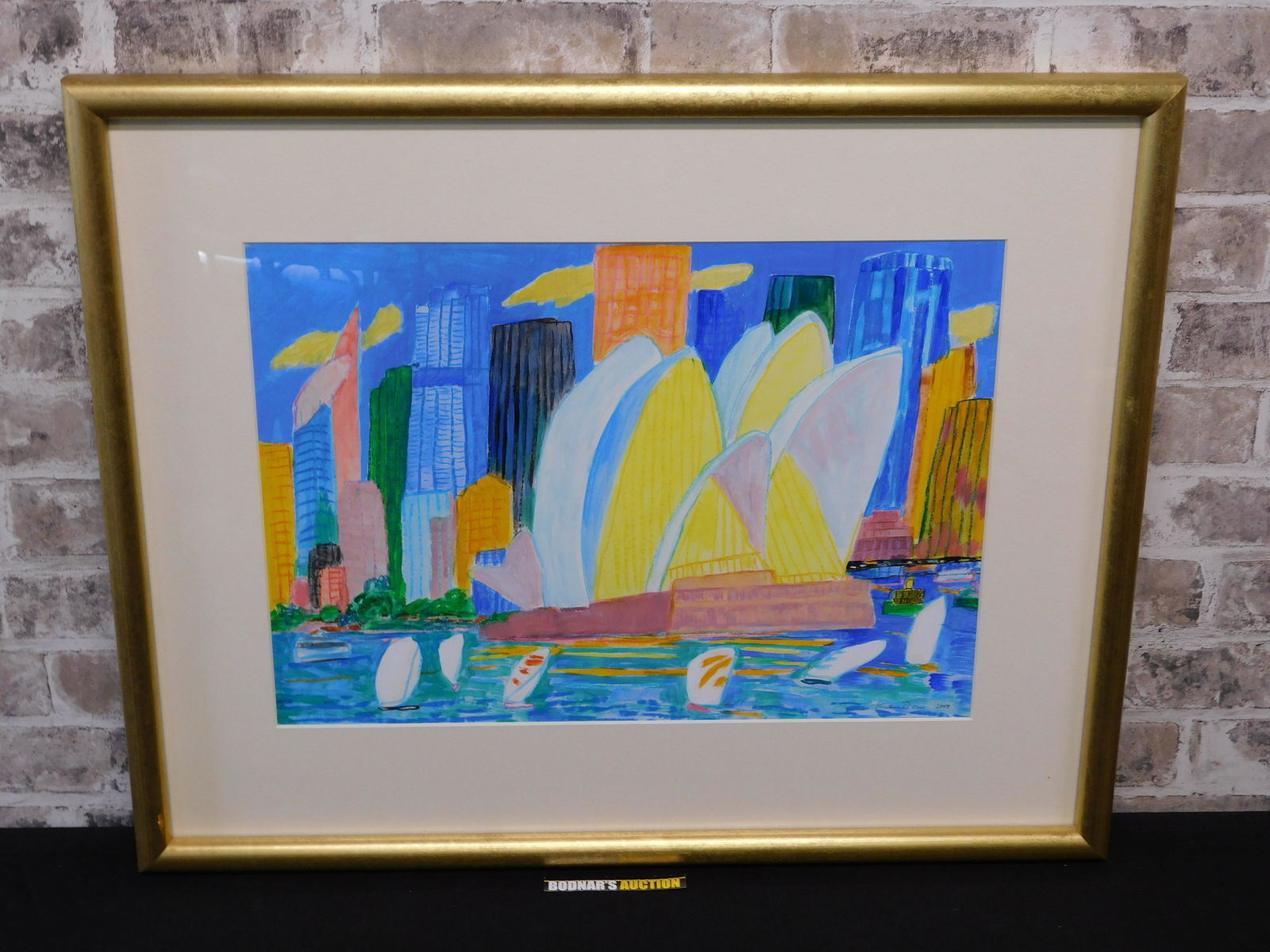 Framed Watercolor by Ken Done: Framed watercolor by Ken Done (Australian 1940-) depicting a Sydney harbor scene, . Signed lower right Ken Done 2004. Frame measures approx. 22.5" tall x 28" wide. Please read the terms and conditions