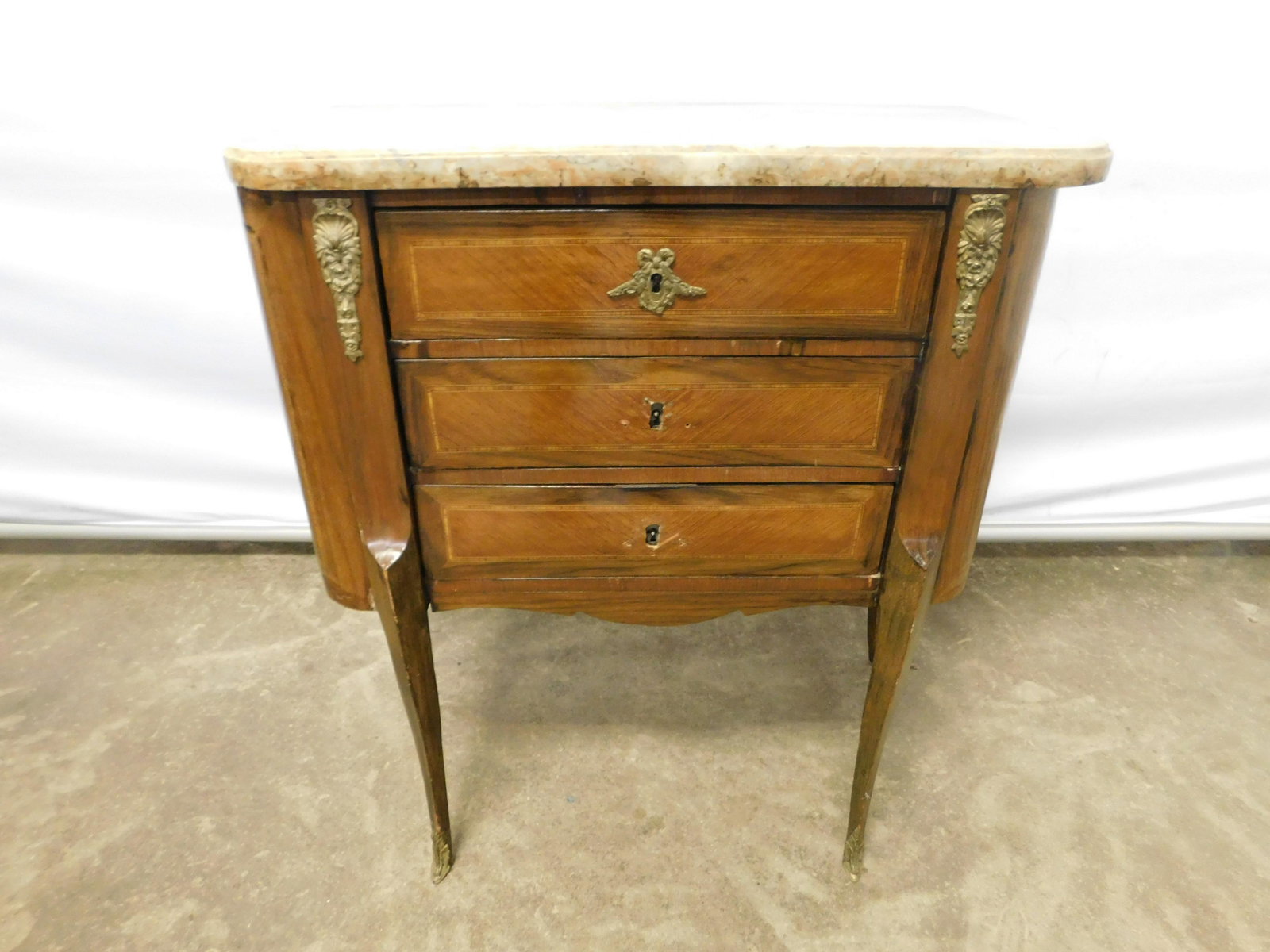 French Marble Top Satinwood Inlaid Nightstand: Turn of the Century French Marble Top Satinwood Inlaid Nightstand with Bronze Mounts. Missing some hardware. Measures 30" tall x 27" wide x 14" deep. Please read the terms and conditions. This sale wi