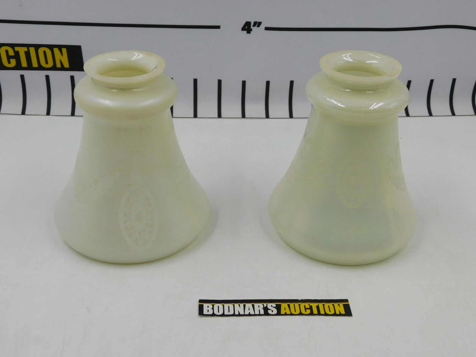 Pair of Art Glass Lamp Shades: Pair of Art Glass Lamp Shades. Steuben Mark. Some chips on rim. Measures approx. 5.5" tall x 4.5" wide. Diameter of fitter is 2.25". All invoices must be paid within 24 hours of the sale. All items ar