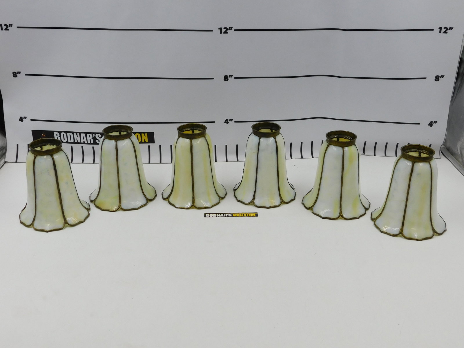 Set of 6 Slag Glass Lamp Shades: Set of 6 Slag Glass Lamp Shades. Measures approx. 5.75" tall x 5" wide. Diameter of fitter Measures approx. 2.25". All invoices must be paid within 24 hours of the sale. All items are shipped with Liv