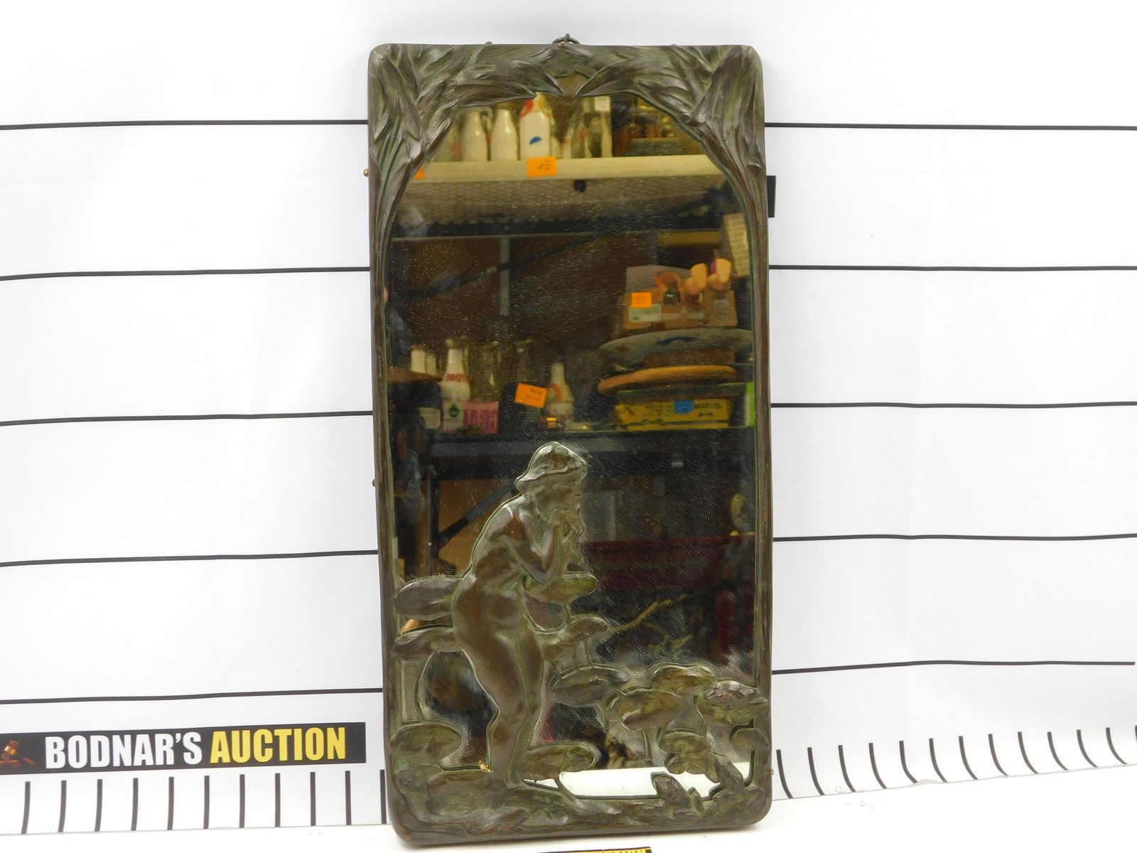 Bronze Art Nouveau Decorative Wall Mirror: Bronze Art Nouveau Decorative Wall Mirror. Nude woman with lily pads and frogs. Minor crack on side. Does not go all the way through. Also missing 2 original side pins. Measures approx. 22" tall x 11"