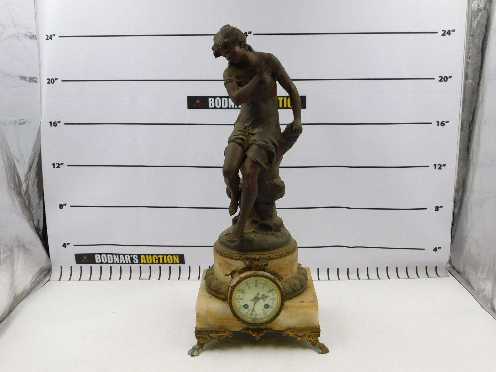 French Marble and Mixed Metal Mantle Clock: French Marble and Mixed Metal Mantle Clock. Back left leg needs to be reattached. Could use a good cleaning. Measures approx. 24" tall x 10" wide x 8" deep. All invoices must be paid within 24 hours o