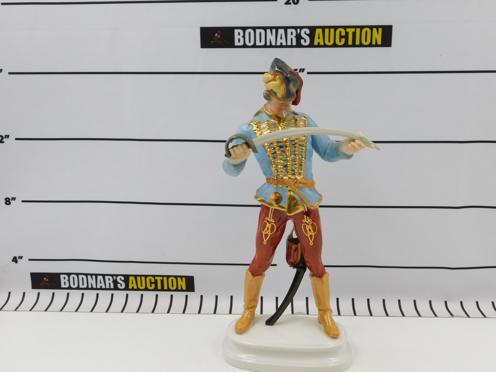Herend Hungarian Hussar: Oversized Herend Figurine, Hungarian Hussar holding sword. Handpainted, Made in Hungary. Measures approx. 16" tall, 7" wide. All invoices must be paid within 24 hours of the sale. All items are shippe