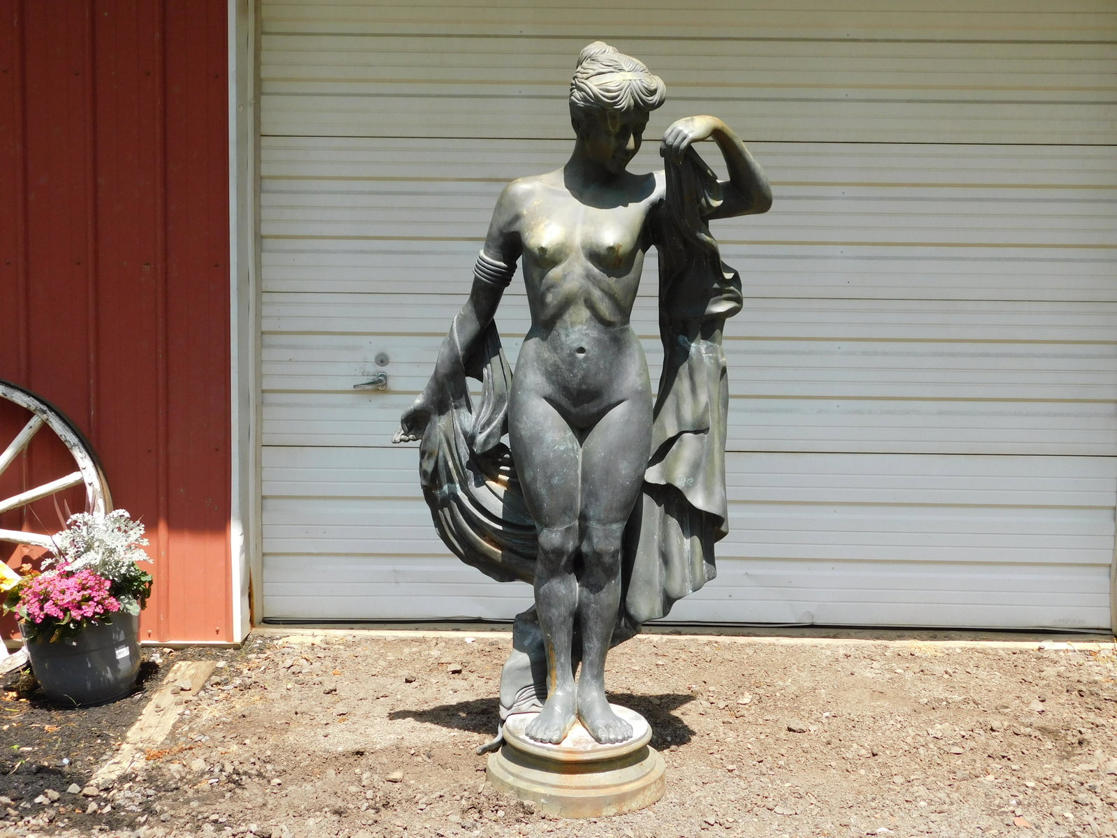 Life Size Bronze of Nude Woman: Contemporary Life Size Bronze Statue of a Nude Woman with draping garment has foundry mark. Measures approx. 77" tall, 36" wide. All invoices must be paid within 24 hours of the sale. All items are sh