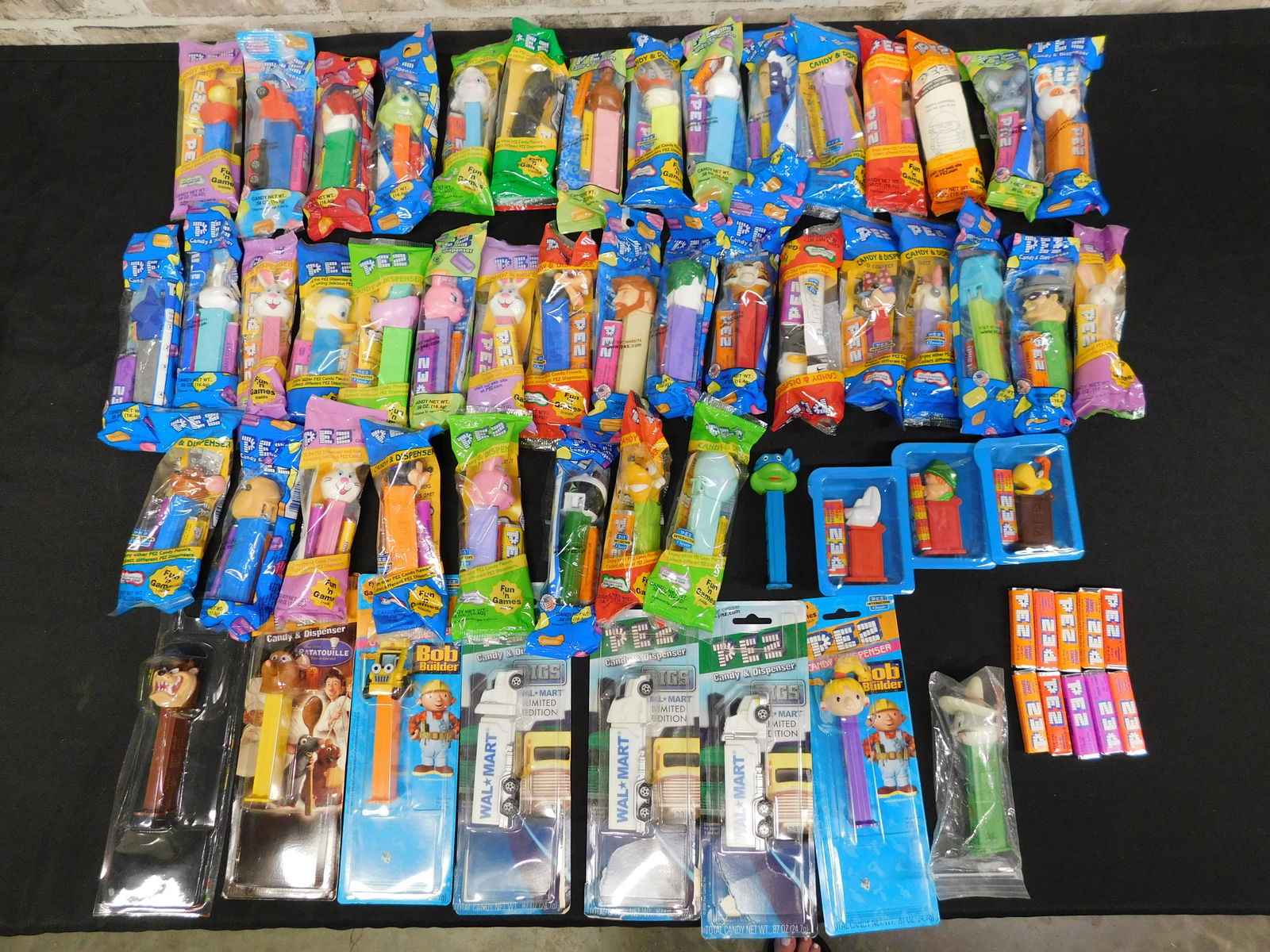 Mixed Lot of Pez - Many Sealed: Mixed Lot of Pez. Including Many Sealed in Package. Characters include Looney Tunes, Disney, Easter, Monsters Inc, Ninja Turtles, Bob the Builder and More. Please read the terms and conditions. This s