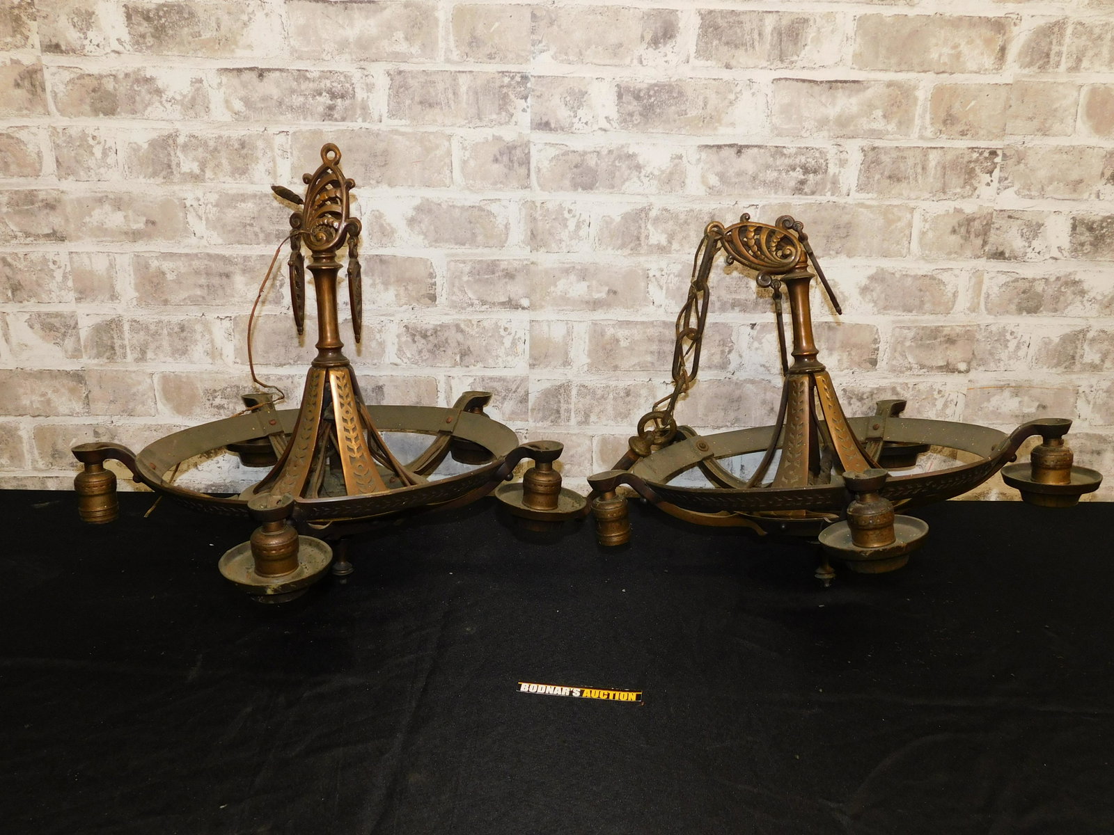 Pair of Art Deco Metal Hanging Chandeliers: Pair of Art Deco Metal Hanging Chandeliers. 3 fitters are missing the metal decoration. Measures 18" diameter x 30.5" tall. Please read the terms and conditions. This sale will be broadcast live on sa