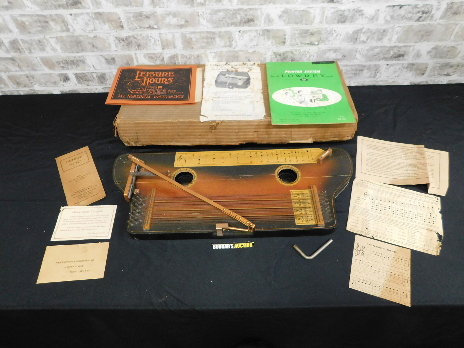 Hawaiian Tremoloa Zither: Hawaiian Tremoloa Zither. Comes with some paperwork. Please read the terms and conditions. This sale will be broadcast live on sale day with full descriptions of each lot being sold. All items MUST be