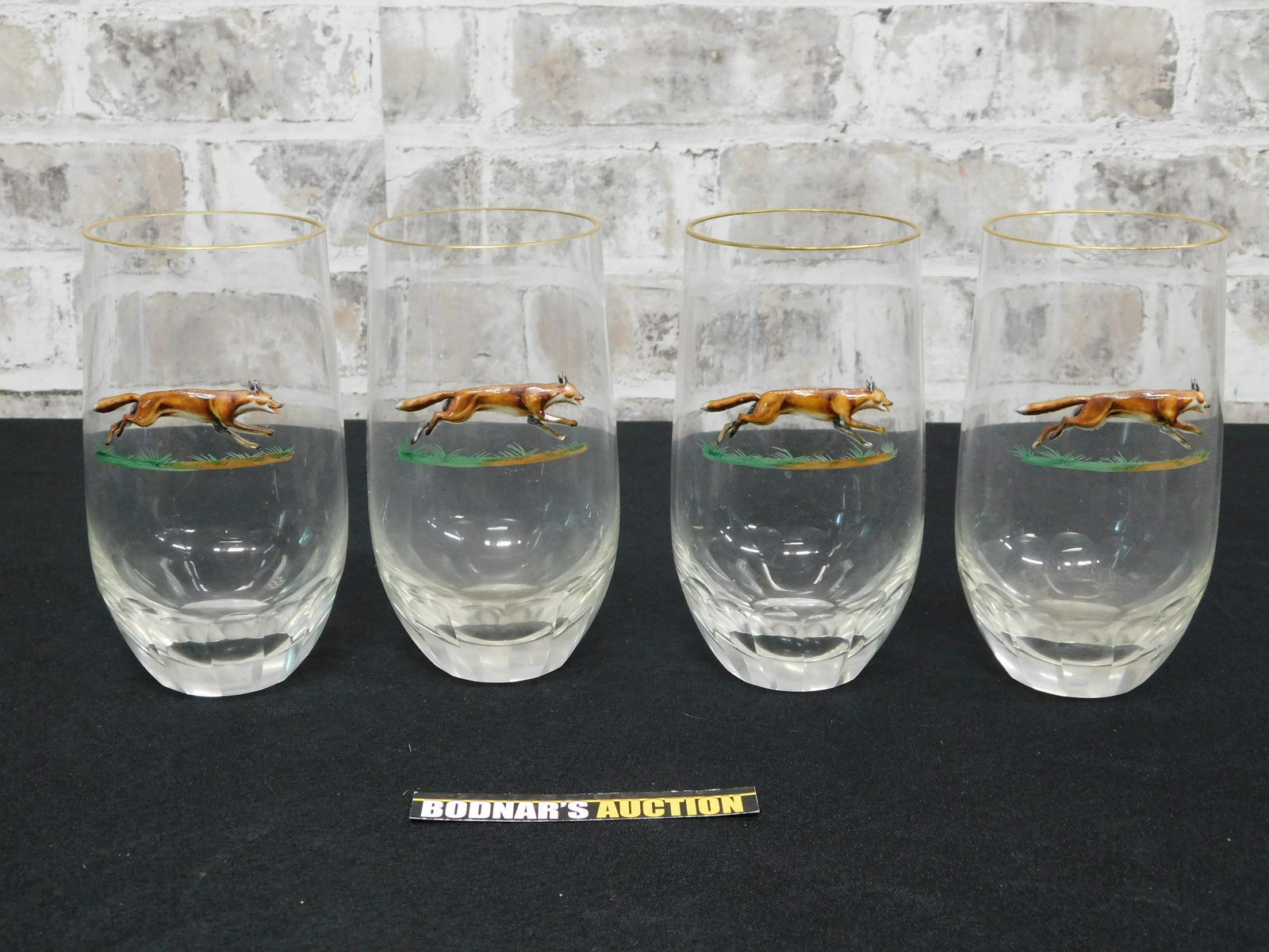 Set of 4 Glasses with Enamel Wolf Decoration: Set of 4 Glasses with Enamel Wolf Decoration. Possibly Unsigned Baccarat. Please read the terms and conditions. This sale will be broadcast live on sale day with full descriptions of each lot being so