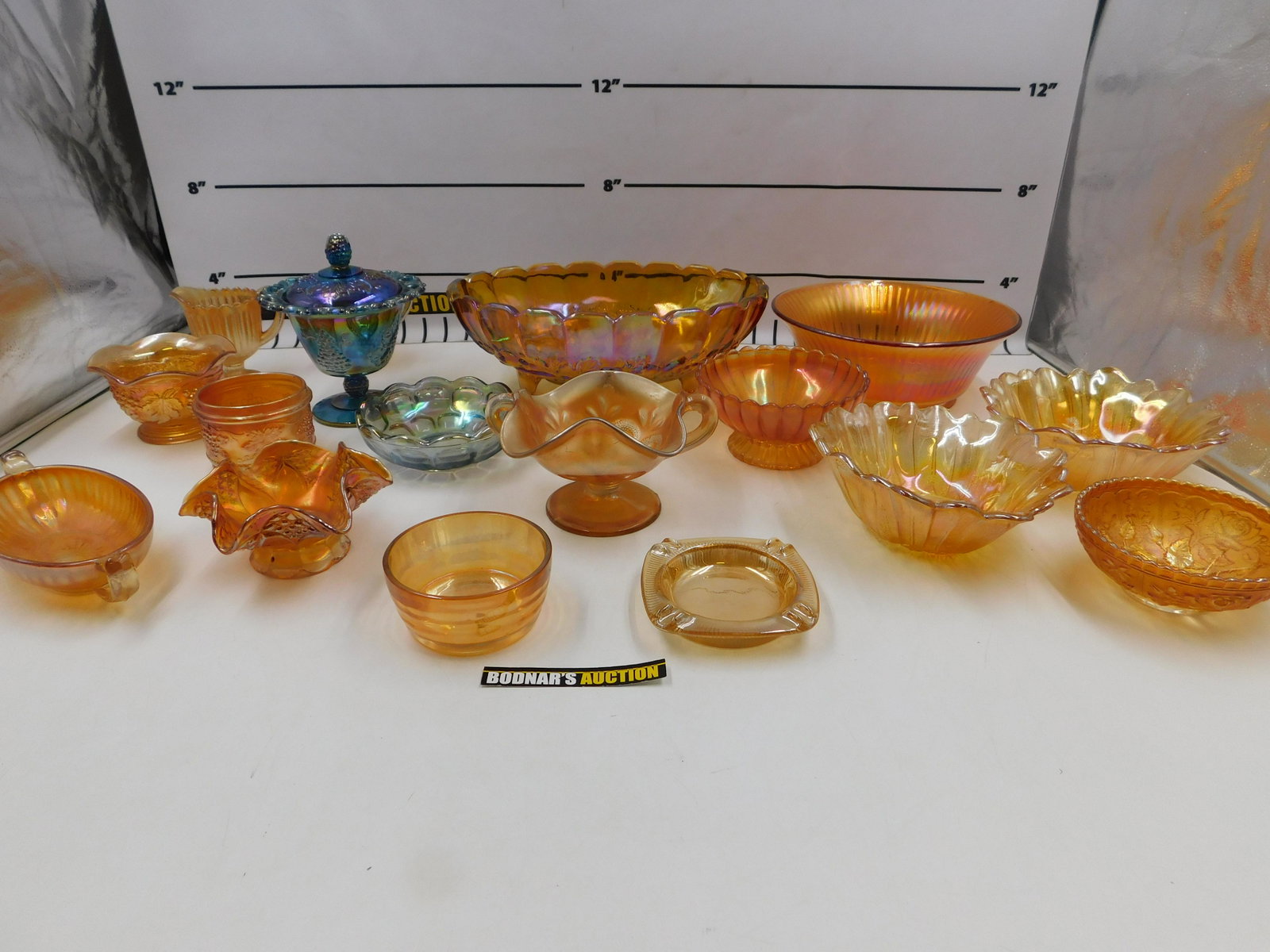 Lot of Carnival Glass: Lot of Carnival Glass. Includes Compote Dishes, Covered Candy Dish, Center Bowls and More. Please read the terms and conditions. This sale will be broadcast live on sale day with full descriptions of 