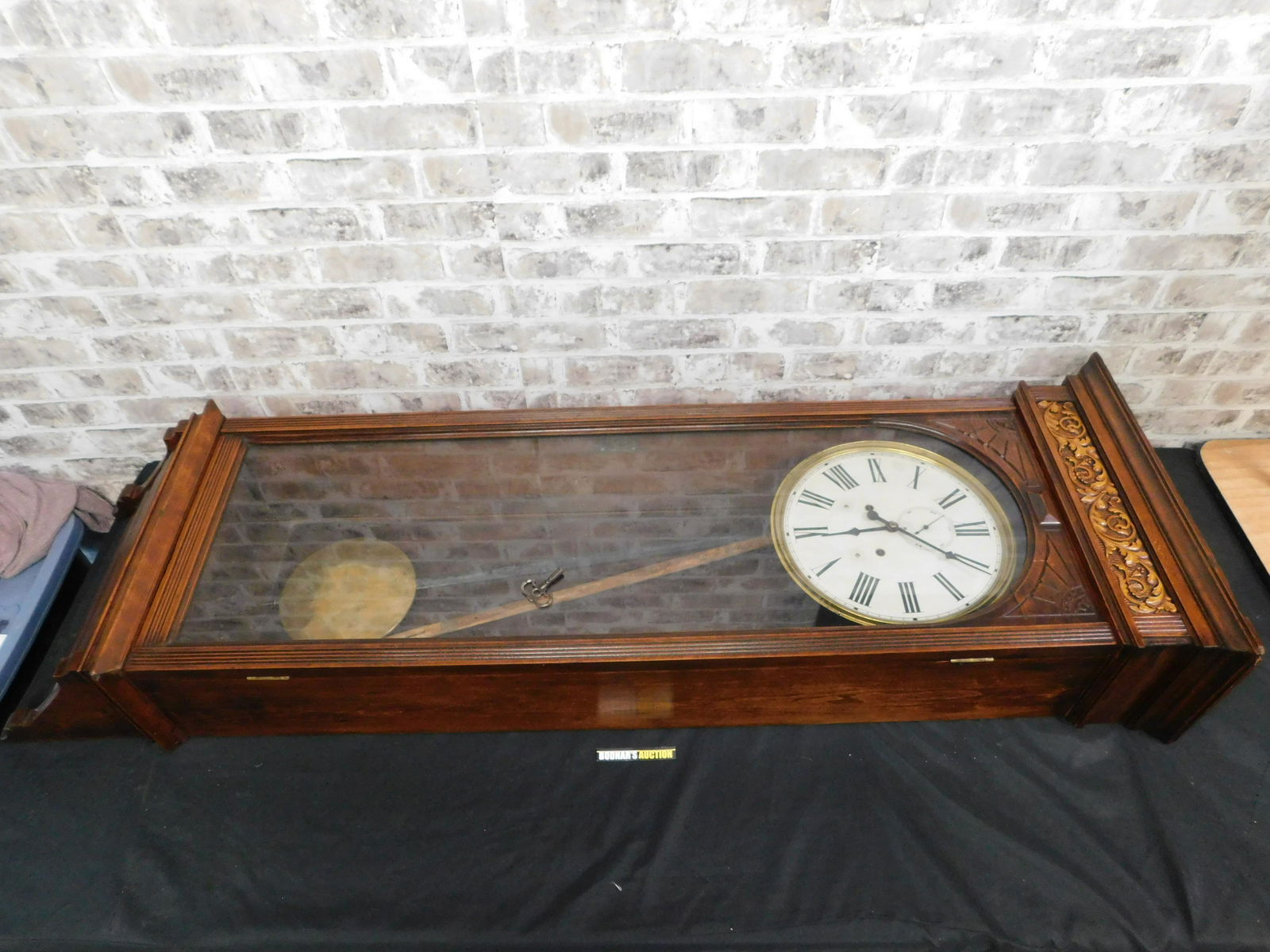 Oversized Wall Regulator: Oversized Wall Regulator. Comes with pendulum and key. Was running when we took it from the estate. Measures 62" tall x 20" wide x 10" deep. Please read the terms and conditions. This sale will be bro