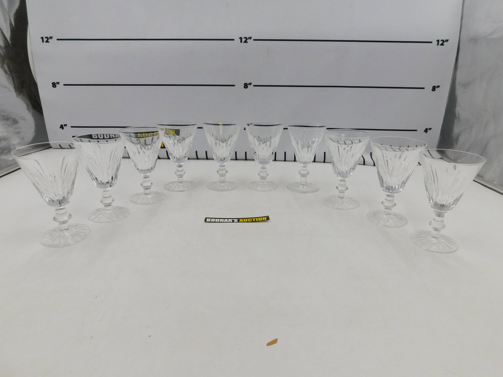 Lot of 10 Waterford Crystal Wine Glasses: Lot of 10 Waterford Crystal Wine Glasses. Measures 5" tall x 3.25" wide. All invoices must be paid within 24 hours of the sale. If you need your items shipped, we are using Liveauctioneers Live Ship. 