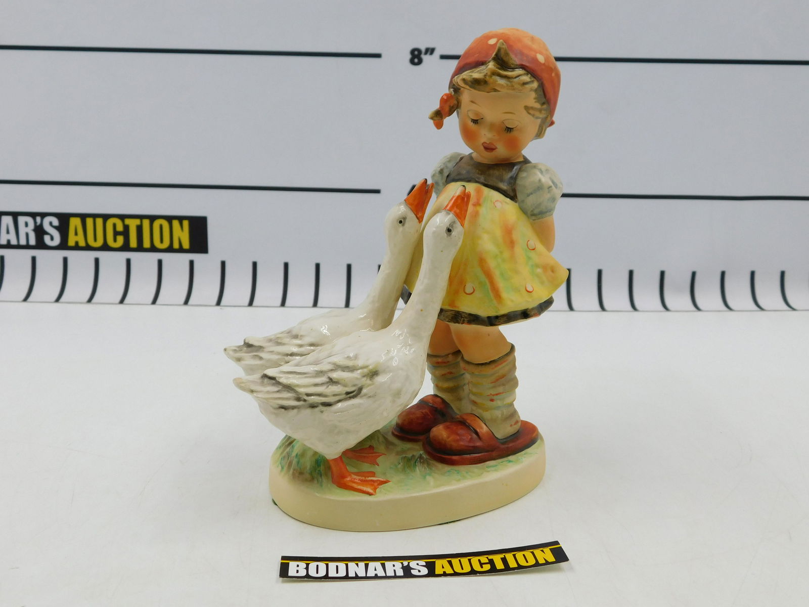 Hummel 47/2 Goose Girl Figurine: Hummel 47/2 Goose Girl Figurine. Measures 7.5" tall. All invoices must be paid within 24 hours of the sale. If you need your items shipped, we are using Liveauctioneers Live Ship. They will pack it an