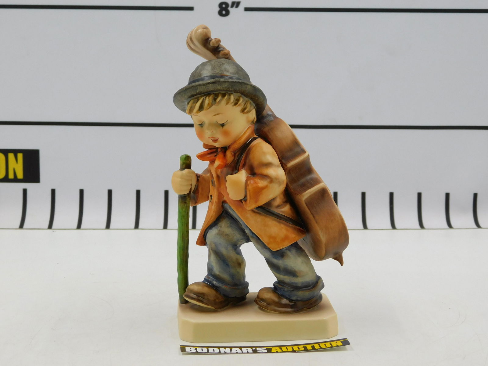 Hummel 89/2 Little Cellist Figurine: Hummel 89/2 Little Cellist Figurine. Measures 7.5" tall. All invoices must be paid within 24 hours of the sale. If you need your items shipped, we are using Liveauctioneers Live Ship. They will pack i