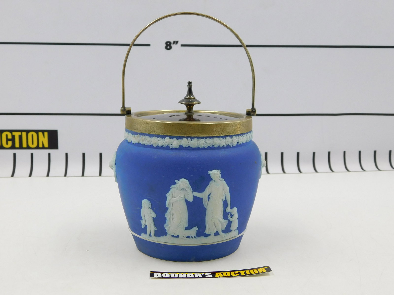 Wedgwood Jasperware Biscuit Jar: Wedgwood Dark Blue Jasperware Biscuit Jar. Measures 7" tall. All invoices must be paid within 24 hours of the sale. If you need your items shipped, we are using Liveauctioneers Live Ship. They will pa