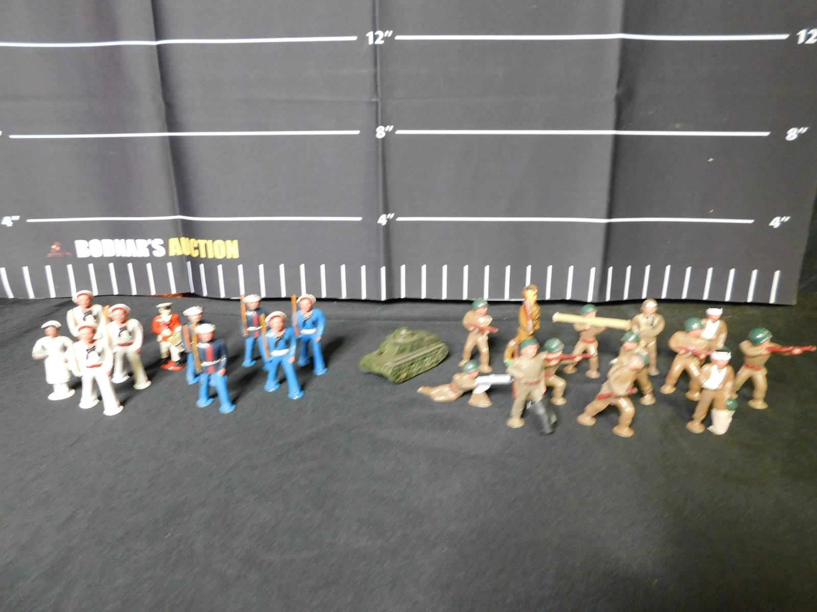 Lot of Lead Soldiers and a Tootsie Toy Tank: Lot of Lead Soldiers and a Tootsie Toy Tank. All invoices must be paid within 24 hours of the sale. All items are shipped USPS or UPS and will be billed separately. A $12 handling fee is added to the 