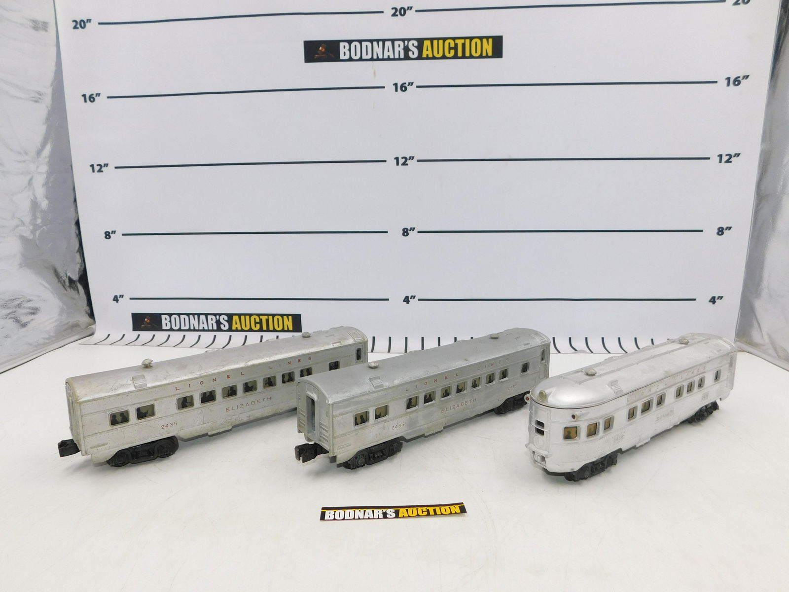 Lot of 3 Lionel Silver Passenger Cars: Lot of 3 Lionel Silver Passenger Cars including (2) #2435, and #2436. Coaches have paint scratching. Does not come in original box. All invoices must be paid within 24 hours of the sale. No trains hav