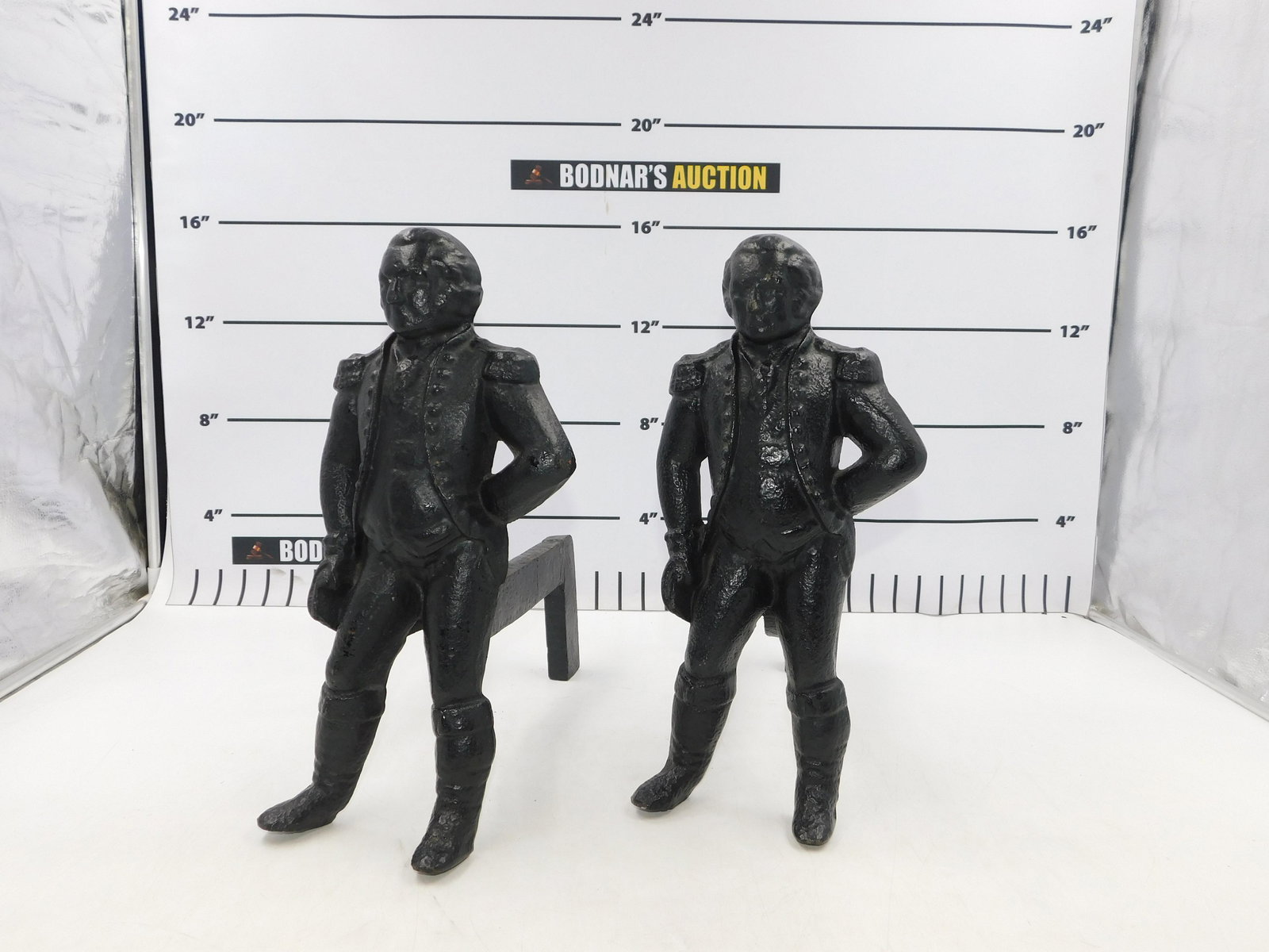 Pair of George Washington Cast Iron Fireplace Andirons: Pair of George Washington Cast Iron Fireplace Andirons. Stamped Virginia Metal Crafters. Measures 16" tall x 14 deep. All invoices must be paid within 24 hours of the sale. This auction is Local Pick