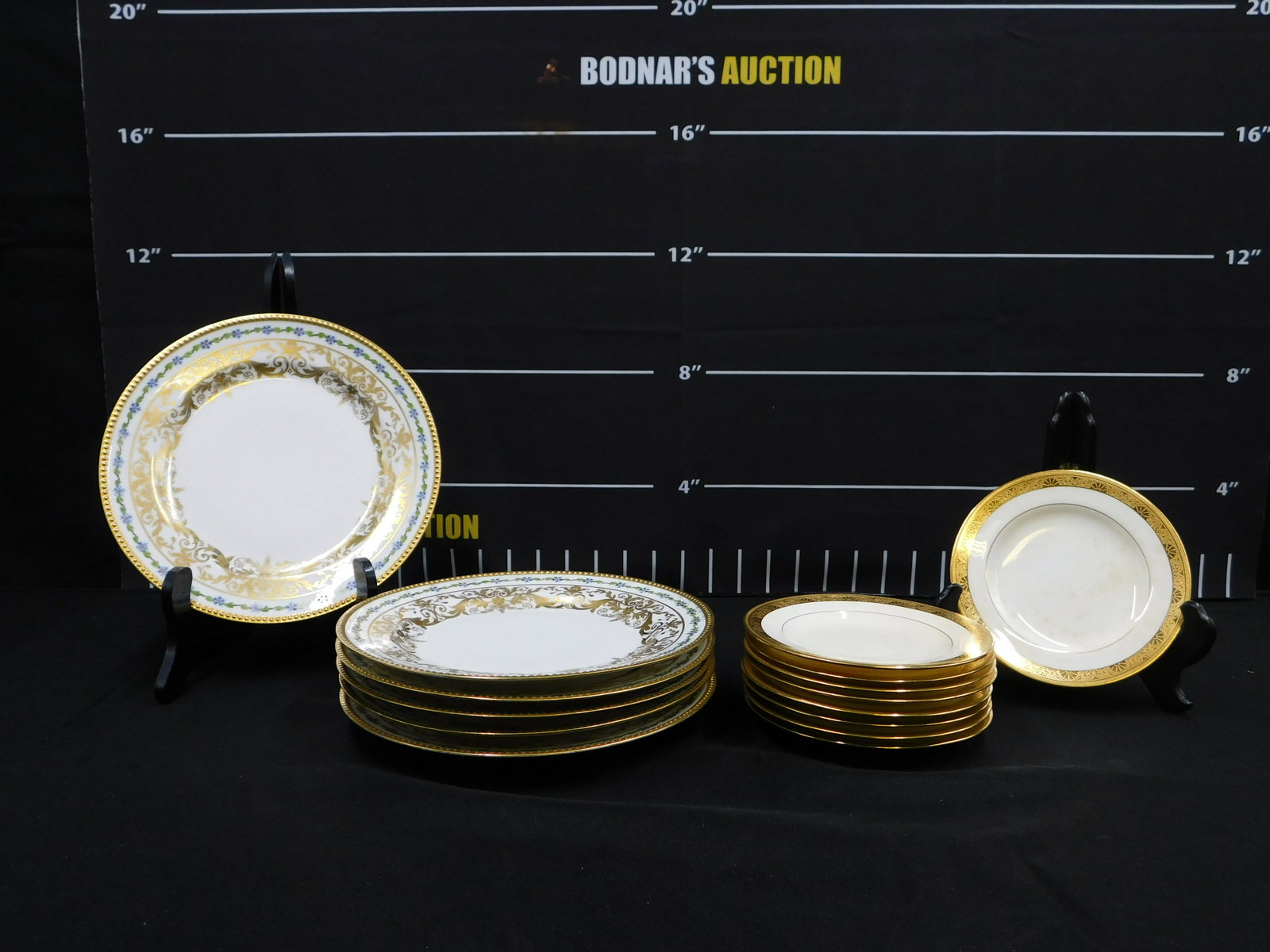 Lot of Porcelain Decorative Plates: Lot of Porcelain Decorative Plates including a Set of 9 Tiffany & Co. 6" Bread Plates - Several have indentation marks in the center and some discoloration, and a Set of (6) 9.5" Hand Painted Limoges 