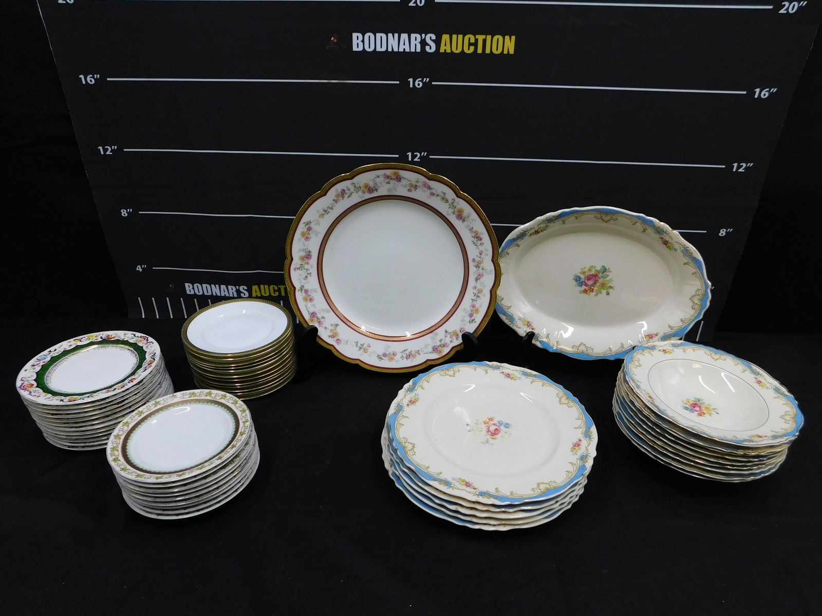 Large Lot of Various Dinnerware: Large Lot of Various Dinnerware including Syracuse China Soup Bowls and Dinner Plates, Royal Bayreuth Bread Plates, MZ Austria Hand Painted Bread Plates, Limoges Serving Platter, and More. All invoice