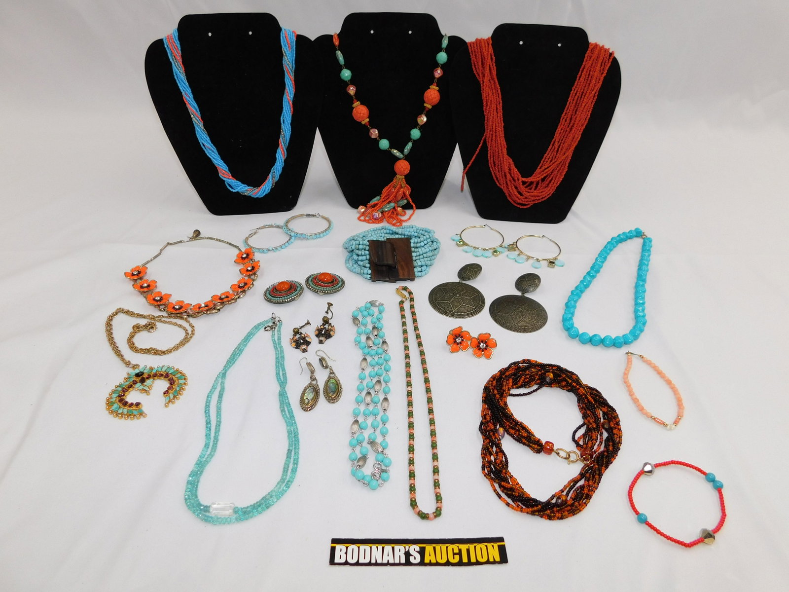 Lot of Southwest Style Costume Jewelry: Lot of Southwest Style Costume Jewelry including Squash Blossom Necklace, Coral Style Necklace, Abalone Earrings and many other interesting pieces. All invoices must be paid within 24 hours of the sal