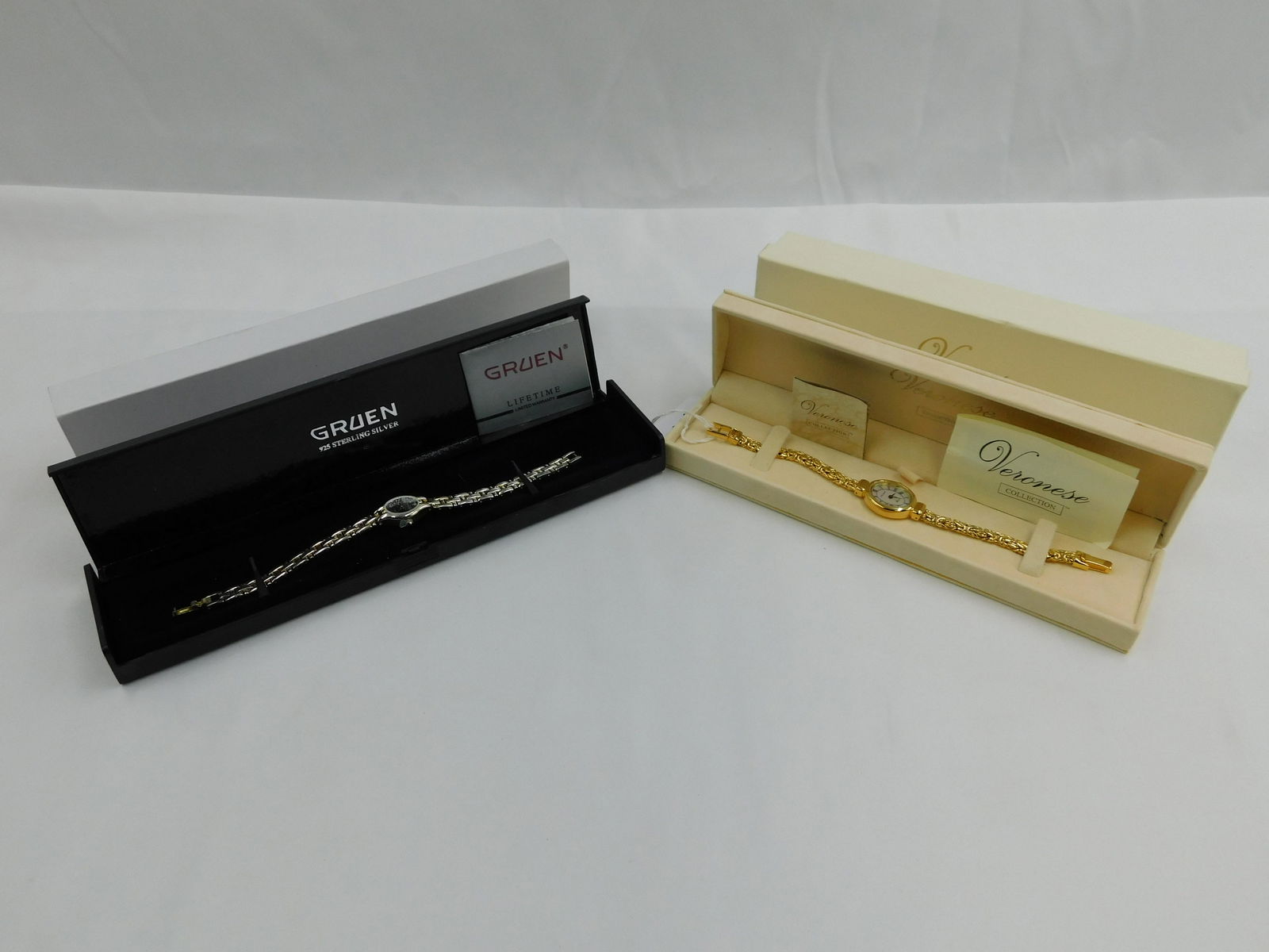 Lot of 2 Sterling Silver Watches: Lot of 2 Sterling Silver Watches including Veronese with Mother of Pearl Face and Gruen with Black Face. Veroneise has gold vermeil finish. Both Marked and Come in Original Boxes. All invoices must be