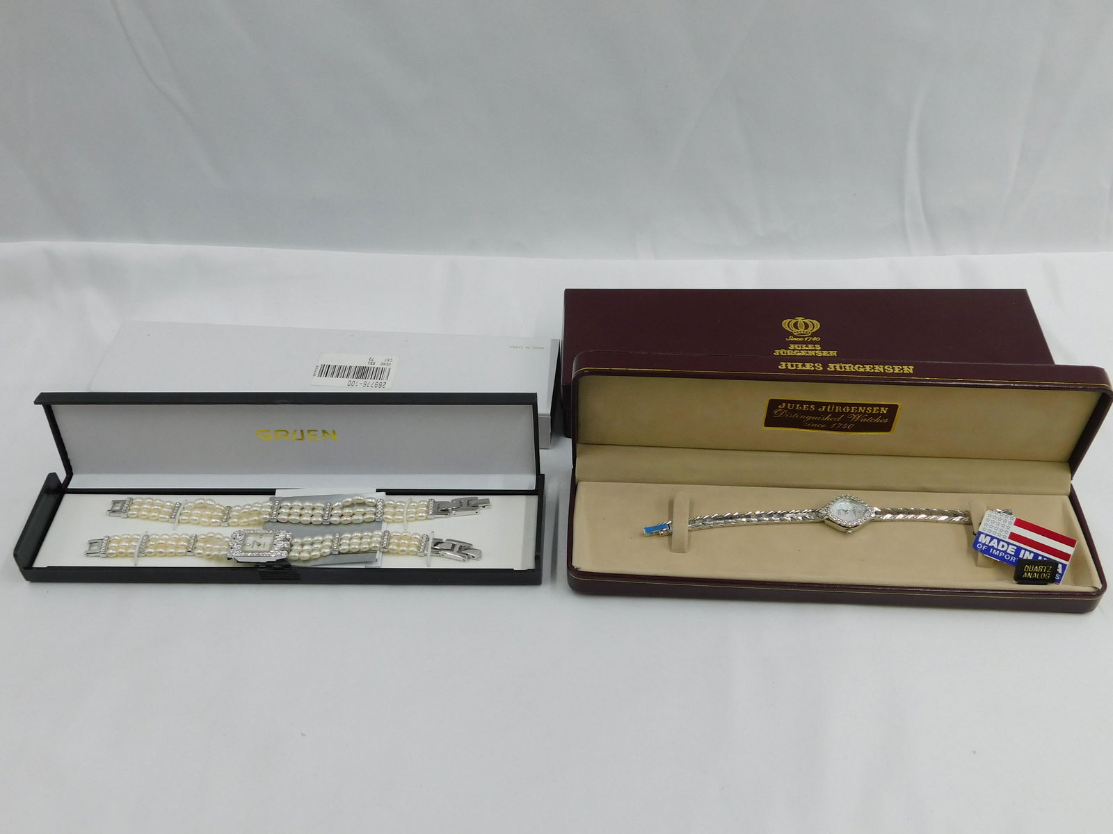 Lot of 2 Ladies Watches: Lot of 2 Ladies Watches including Gruen Faux Pearl and Mother of Pearl Face Watch with Matching Bracelet and Jules Jurgensen Silver Tone and Rhinestone Watch with Mother of Pearl Face. Both have origi