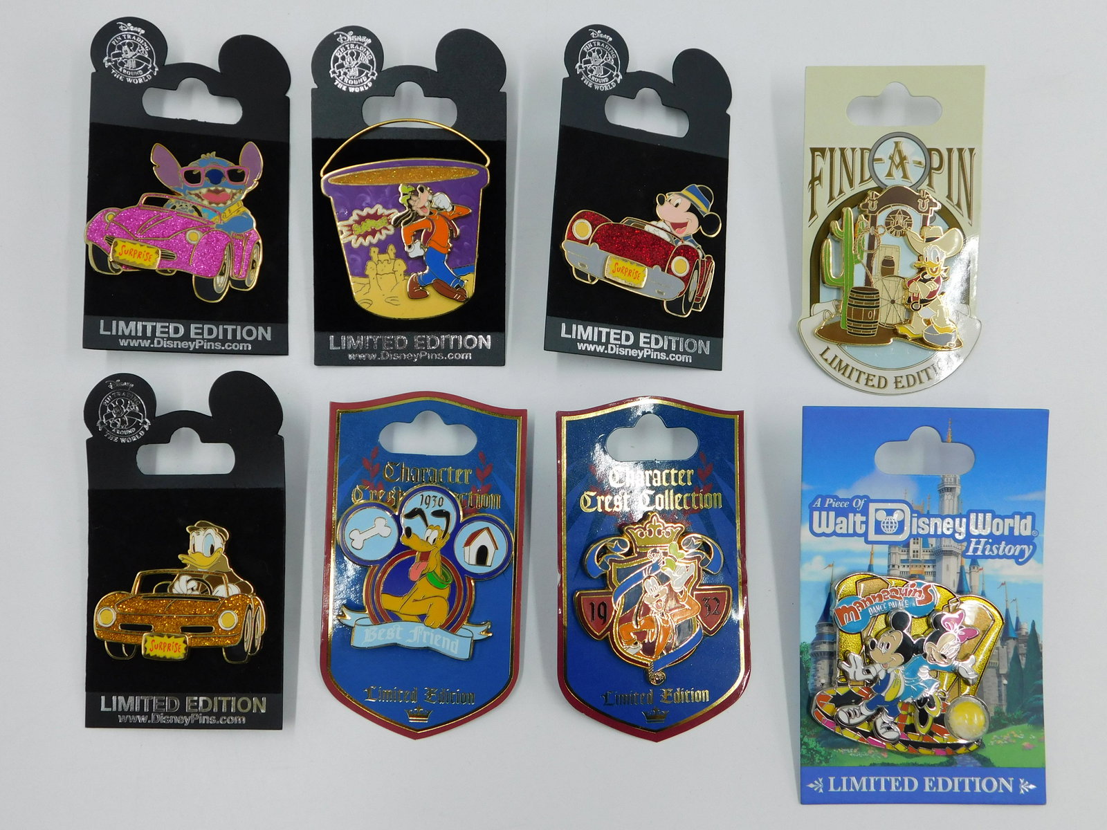 Lot of 8 Disney Limited Edition Pins: Lot of 8 Disney Limited Edition Pins including (3) Surprise Glitter Cars - Stitch, Donald, and Mickey, (1) Surprise Pail - Goofy, (2) Character Crest Collection - Pluto and Goofy, (1) Find-A-Pin Donal