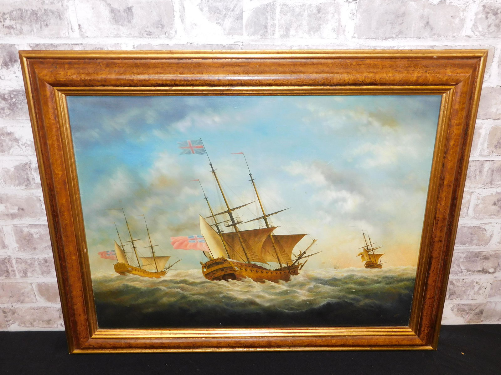 Oil on Canvas of British Ships: Oil on Canvas Monogramed Lower Right - Appears to be G.F. Depicts British Tall Sailing Ships at Sea. Measures 23" tall x 29" wide. All invoices must be paid within 24 hours of the sale. Shipping optio