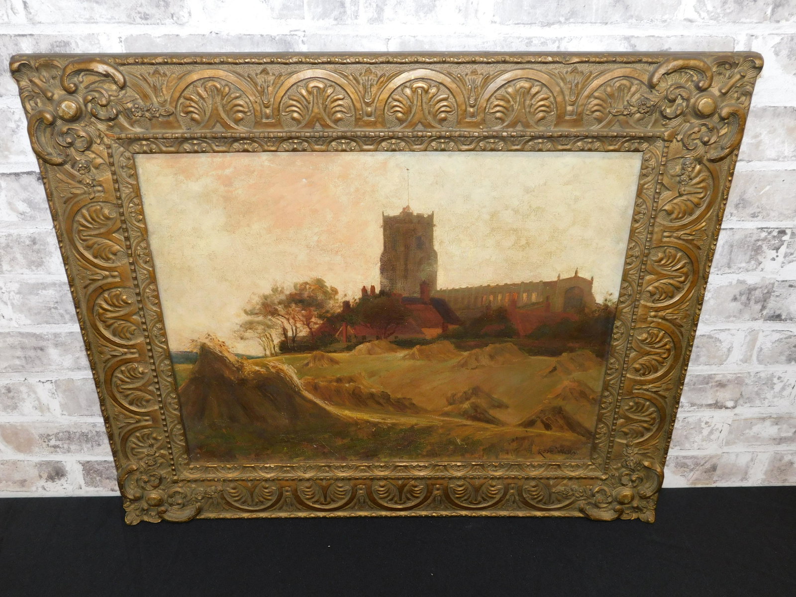 Oil on Canvas of Church Scene: Turn of the Century Oil on Canvas by Rose Ellen Welby (1879-1927). Depicting a Church and Homes overlooking Wheat Field. Signed lower right. Measures 23" tall x 26.5" wide. All invoices must be paid w