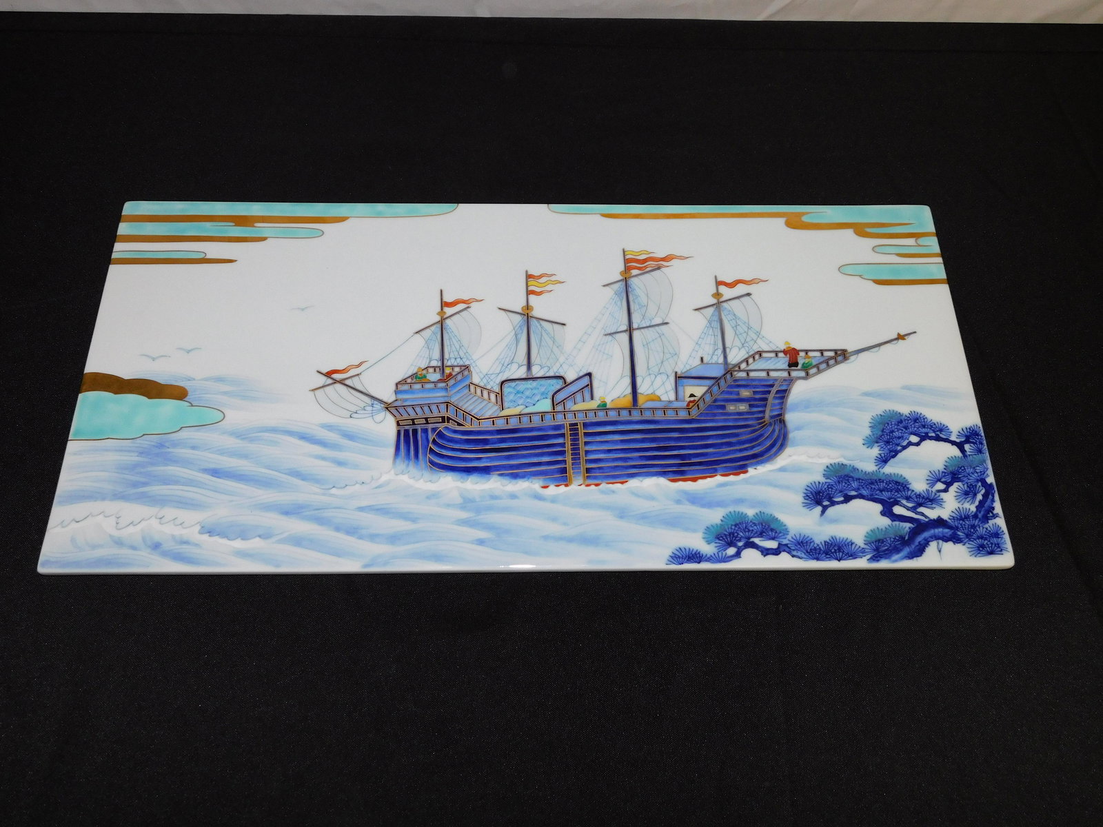 Hand Painted Tile - Sail Ship in Water: Hand Painted Tile depicting Sail Ship in Water. Signed on back - Undetermined. Measures 10" tall x 21" wide. All invoices must be paid within 24 hours of the sale. Shipping options are the Liveaship f