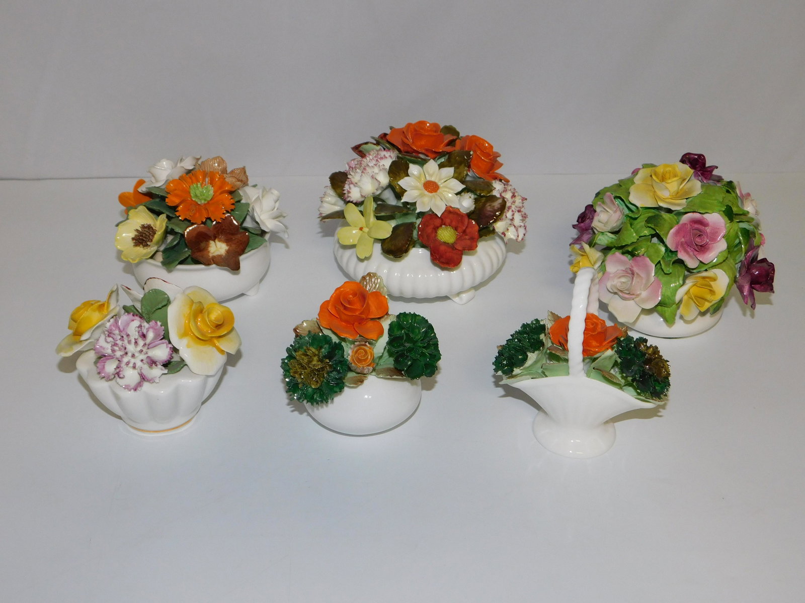 Lot of 6 Porcelain Flower Baskets: Lot of 6 Porcelain Flower Baskets including Staffordshire, Jon Anton, (3) Royal Adderley, and Sandford. Minor chips here and there but overall good condition. The small basket broke at preview. Larges