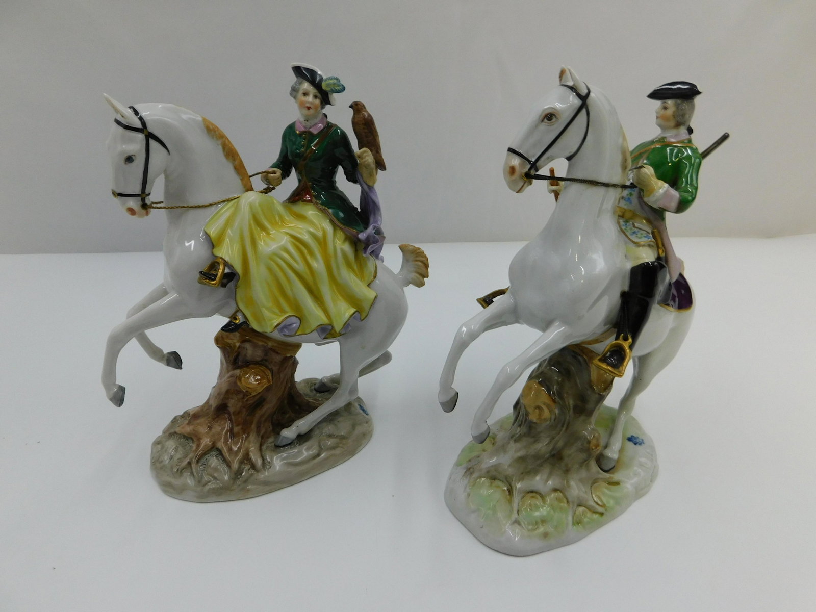 Pair of German Volkstadt Porcelain Figurines: Pair of German Volkstadt Porcelain Figurines - Man and Woman on Horseback. Largest measures 8.5" tall x 7" wide. All invoices must be paid within 24 hours of the sale. Shipping options are the Liveash
