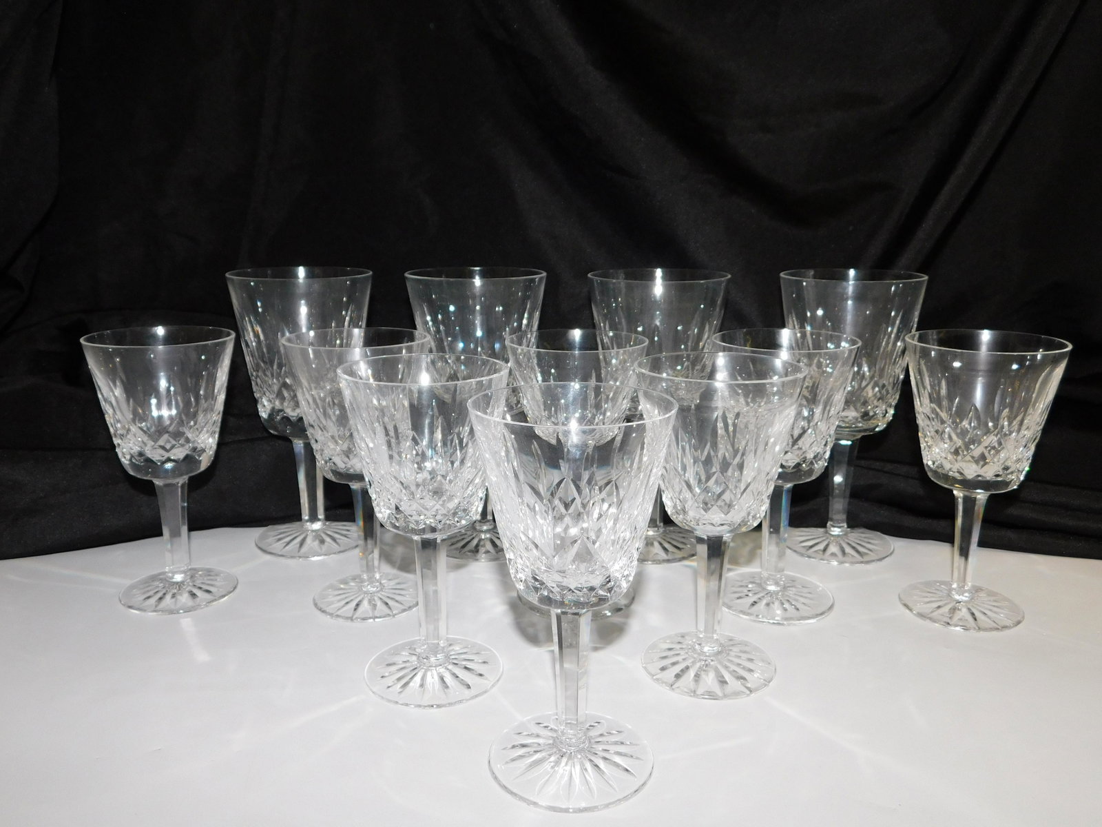Lot of 12 Waterford Crystal Stems: Lot of 12 Waterford Crystal Stems - Lismour Pattern. Includes (8) 7" Wine Glasses and (4) 5.75" Wine Glasses. All invoices must be paid within 24 hours of the sale. Shipping options are the Liveaship 