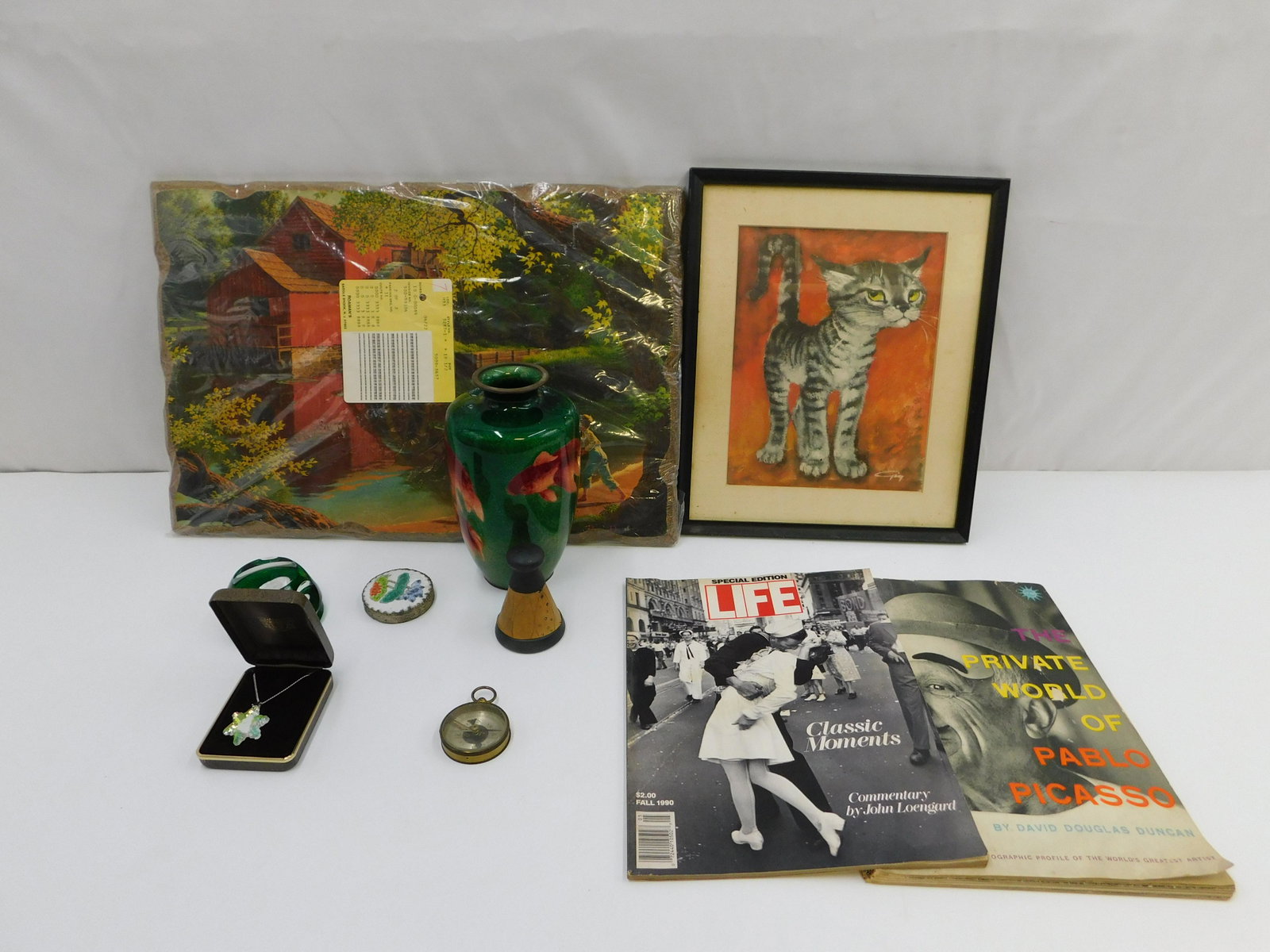 Group Lot of Estate Finds: Group Lot of Estate Finds including Baccarat Paperweight, AS-IS Cloisonne Goldfish Vase - Missing Base, Pablo Picasso Magazine and Framed Art. All invoices must be paid within 24 hours of the sale. Sh